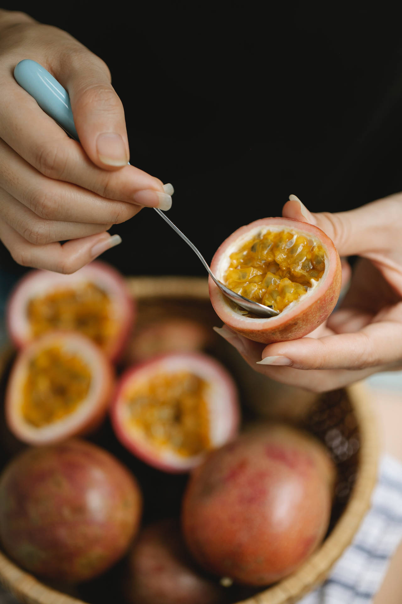 Delicious Passion Fruit Scooped With Spoon Background