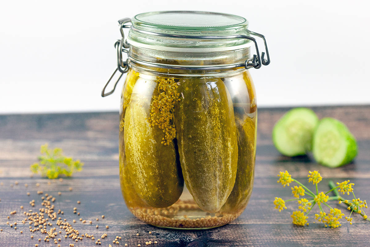 Delicious Pickles Resting In An Airtight Glass Jar Background