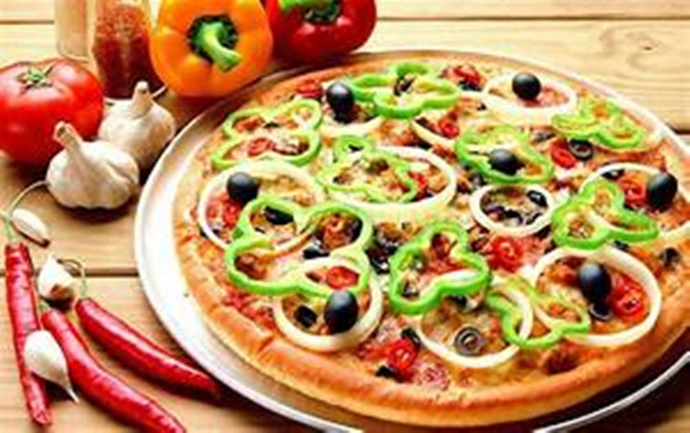 Delicious Pizza Topped With Green Pepper Thin Slices Background