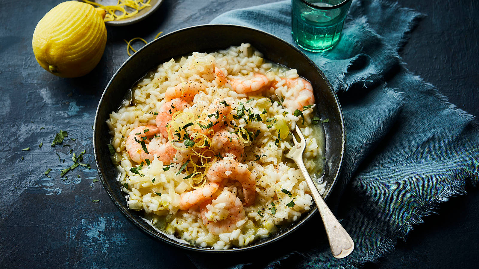 Delicious Prawn And Celery Risotto Served On A Plate Background