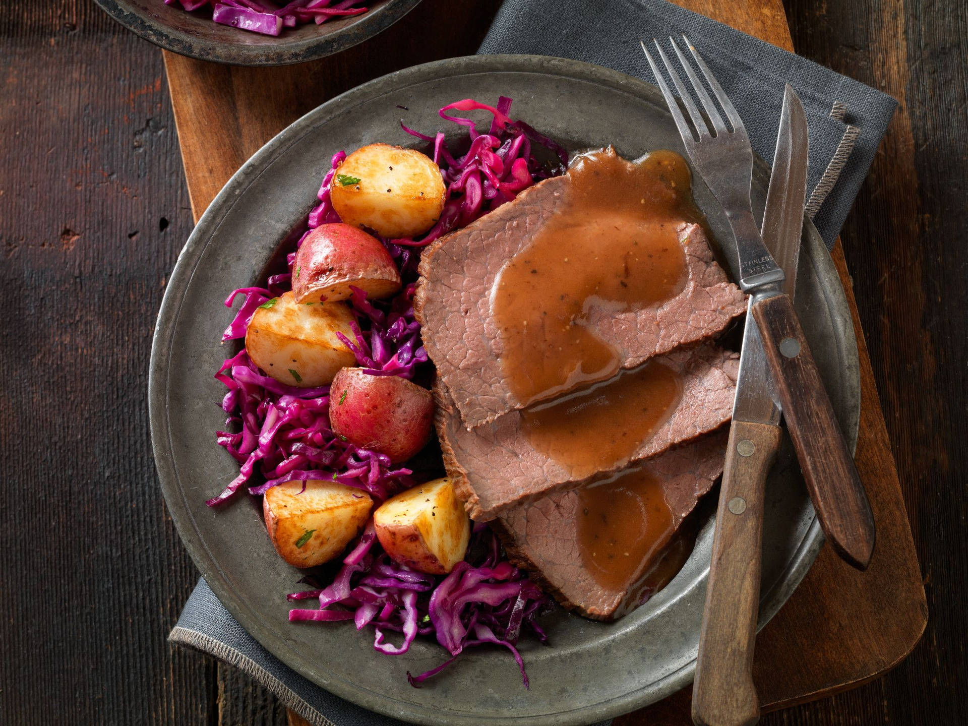 Delicious Sauerbraten With Potatoes And Red Cabbage