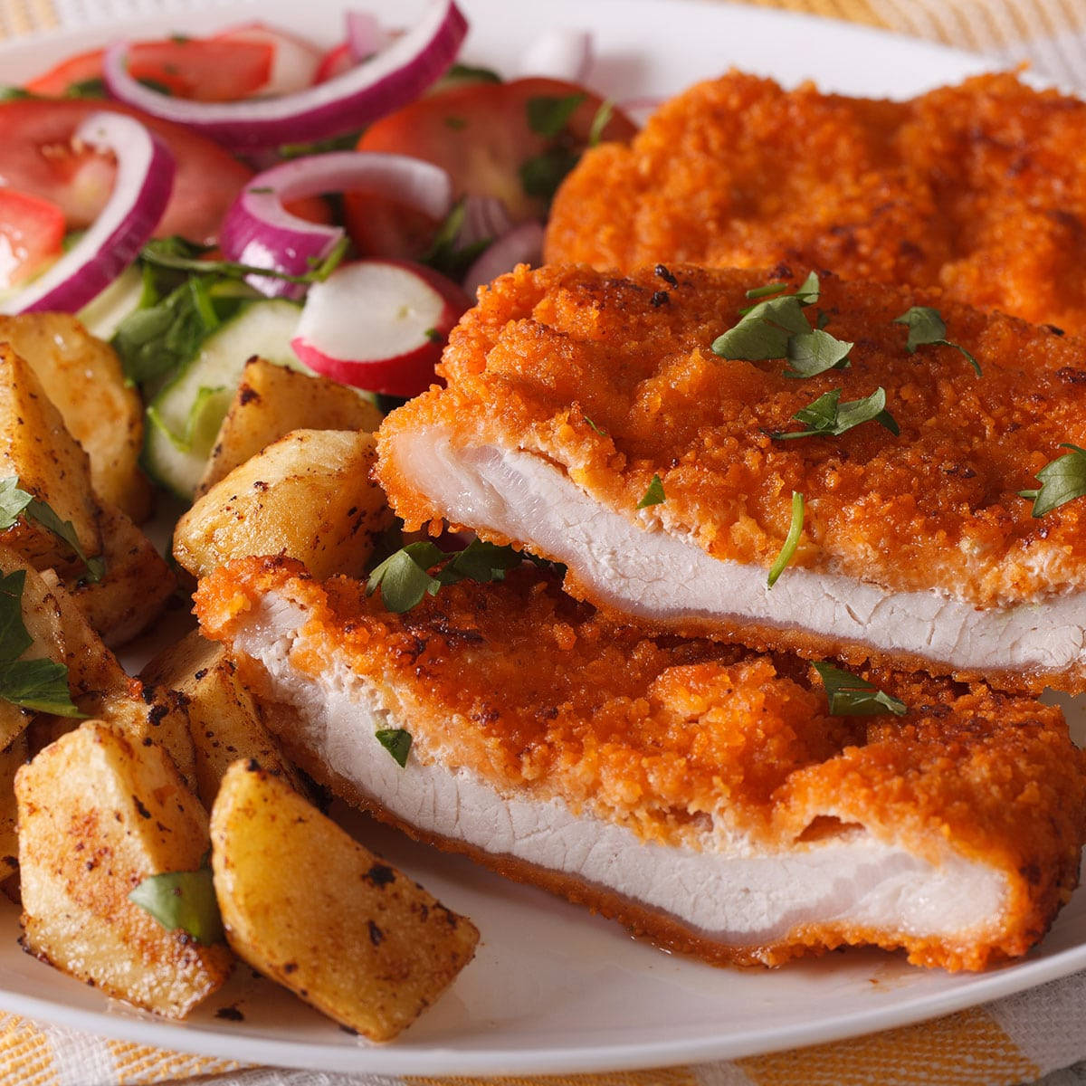 Delicious Traditional Wiener Schnitzel Served On Plate Background