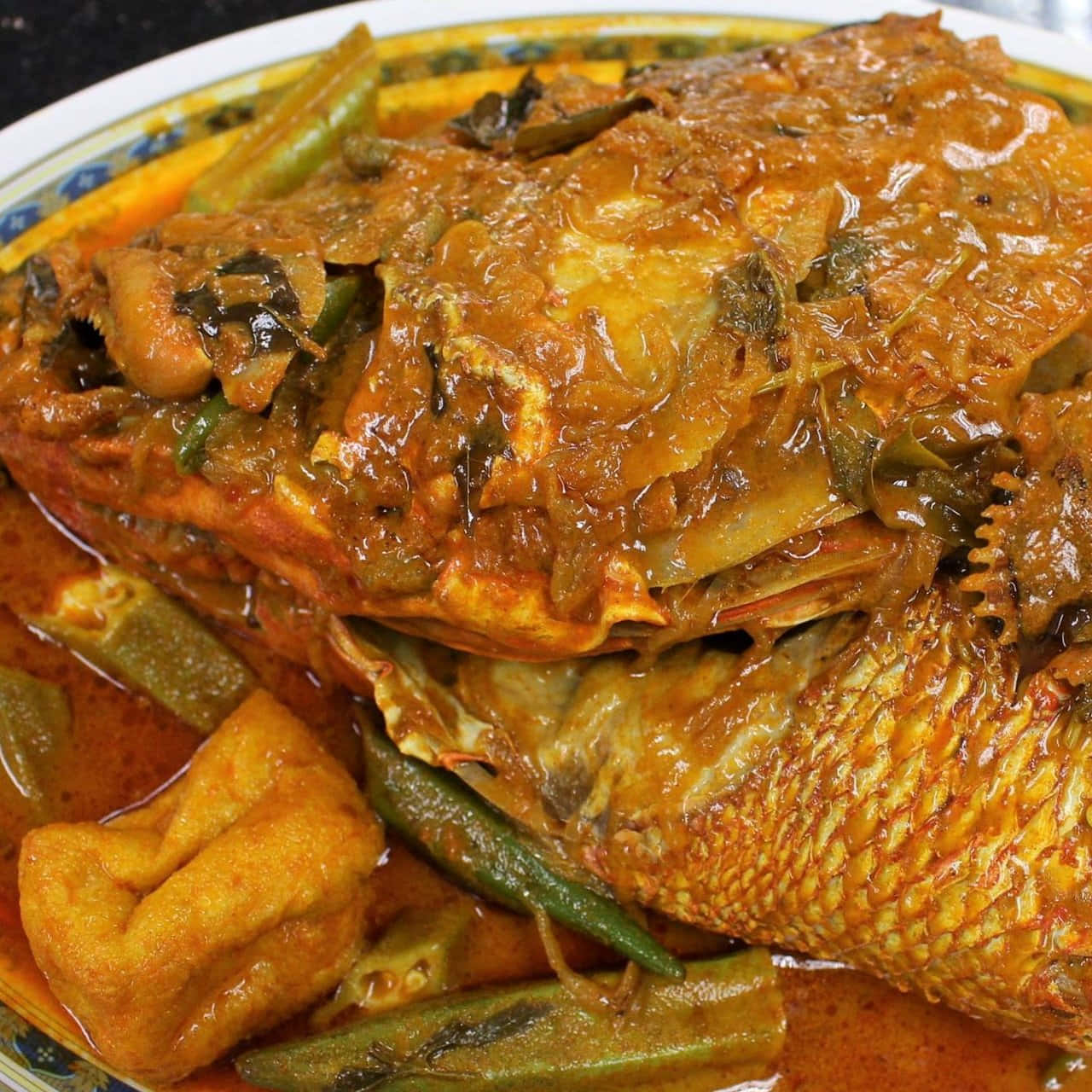 Delight In The Flavors With Fish Head Curry, A Signature Malaysian Dish Background