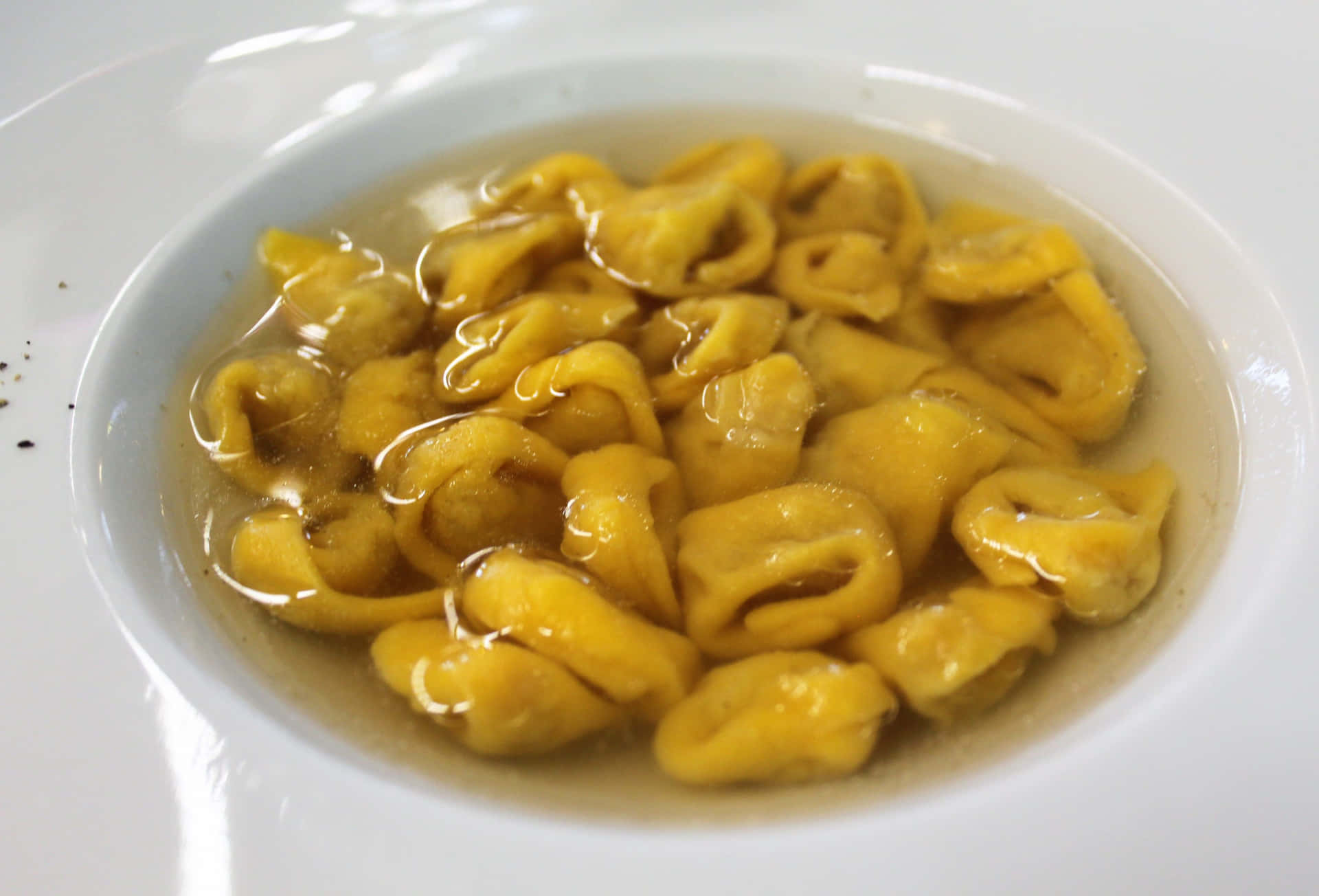 Delightful Bowl Of Tortellini In Brodo Background