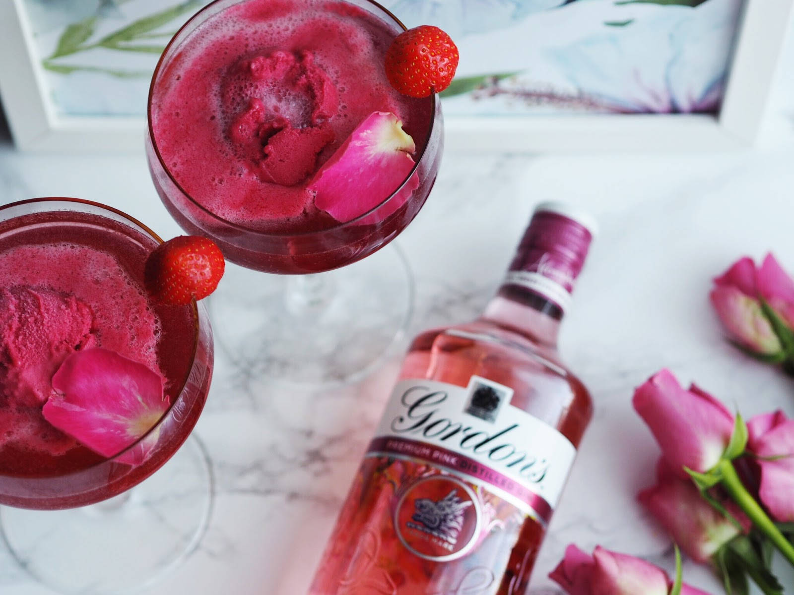 Delightful Gordon's Pink Gin Cocktail With Fresh Strawberries Background