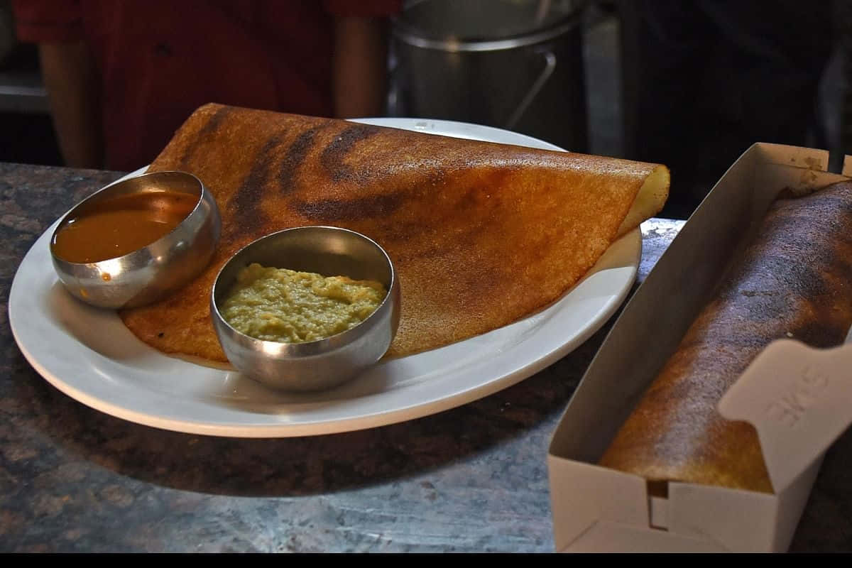Delightful Indian Dosa Cuisine Background