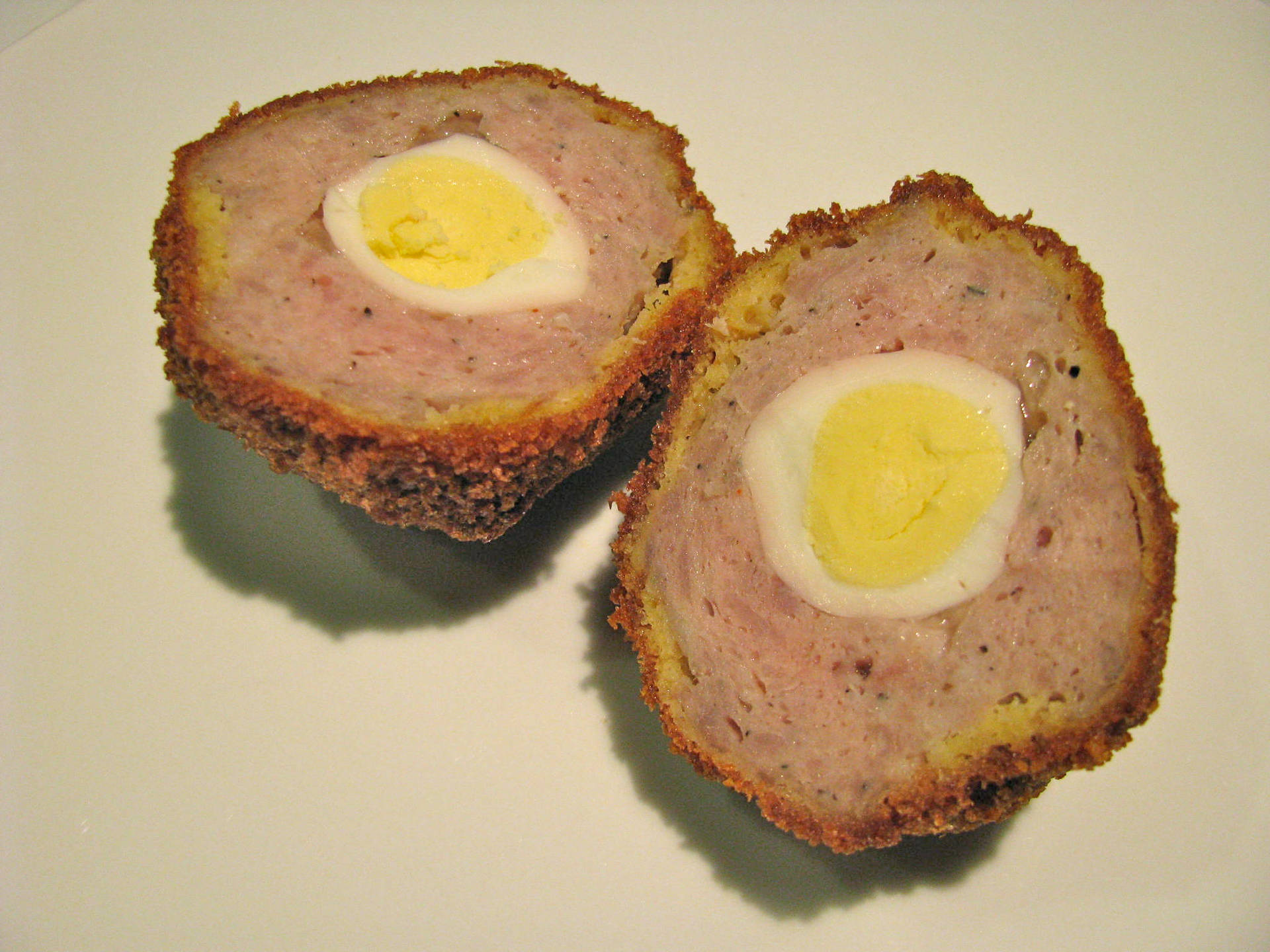 Delightful Traditional British Scotch Egg Made From Quail Background