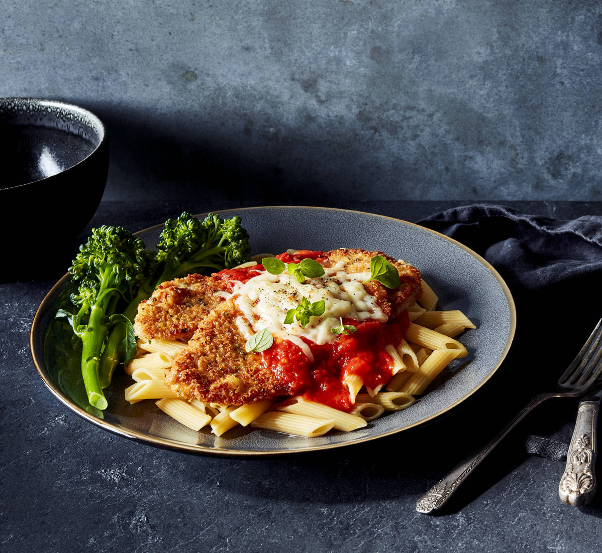 Delightfully Cheesy Pork Parmigiana With Arrabbiata Sauce And Penne Pasta Background