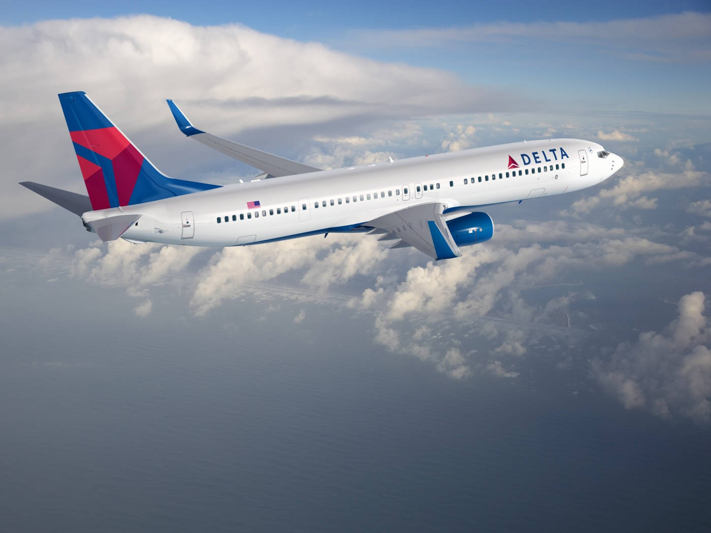 Delta Airlines Airplane Flying Above The Clouds Background
