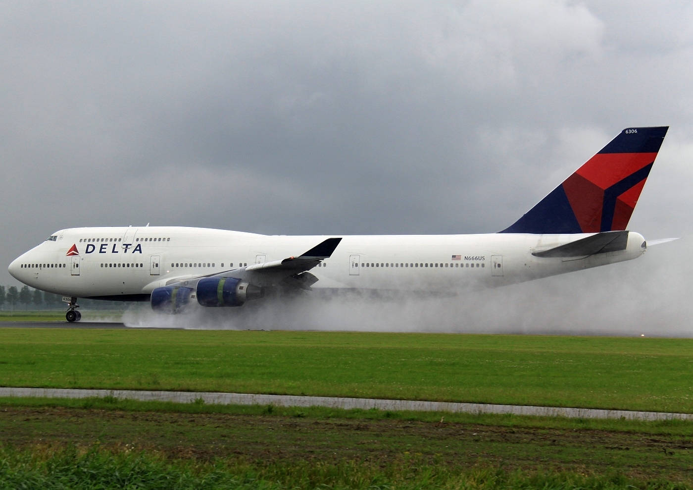 Delta Airlines Airplane Smoke On Grass Field Background