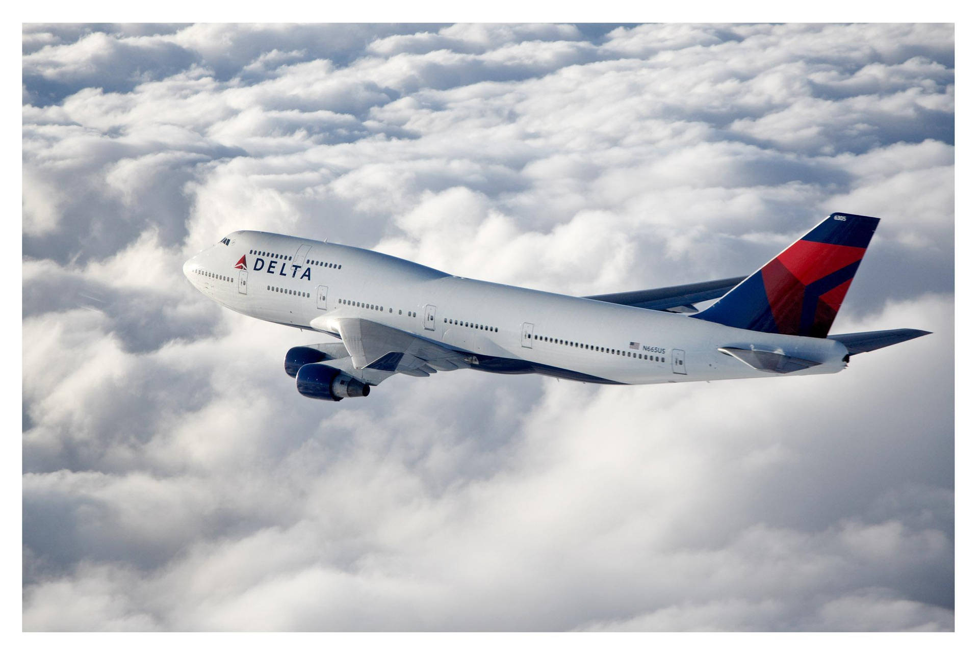 Delta Airlines Plane On Clouds