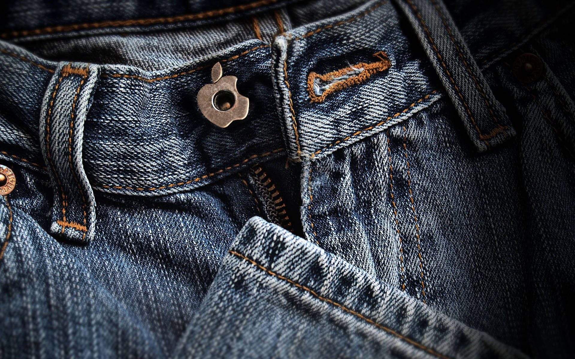 Denim Jeans With Apple Logo Background