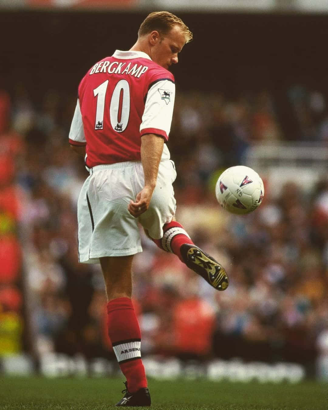 Dennis Bergkamp Kicking Ball Against Bradford City Background
