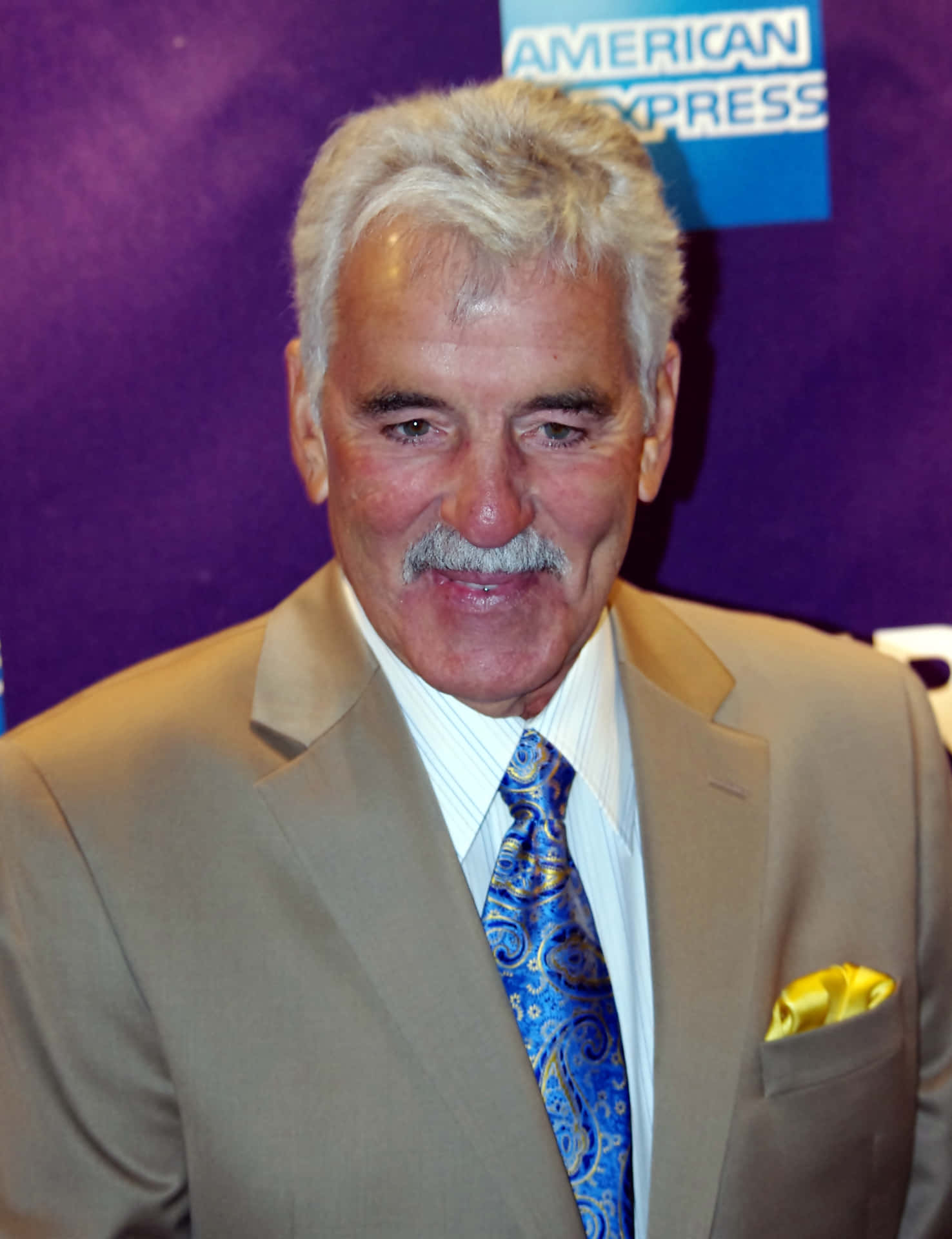 Dennis Farina In A Suave And Sophisticated Pose Background