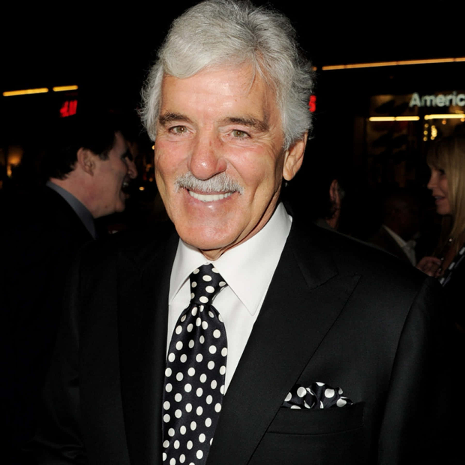 Dennis Farina Posing In A Tailored Suit