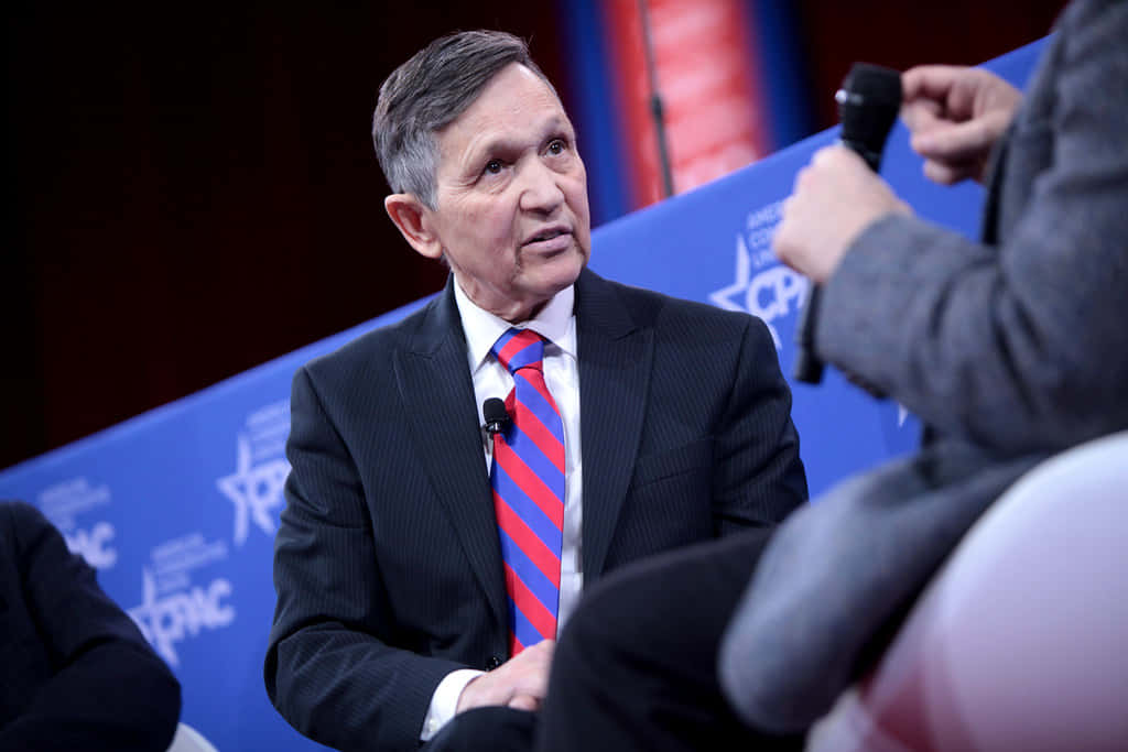 Dennis Kucinich Listening To A Person Background