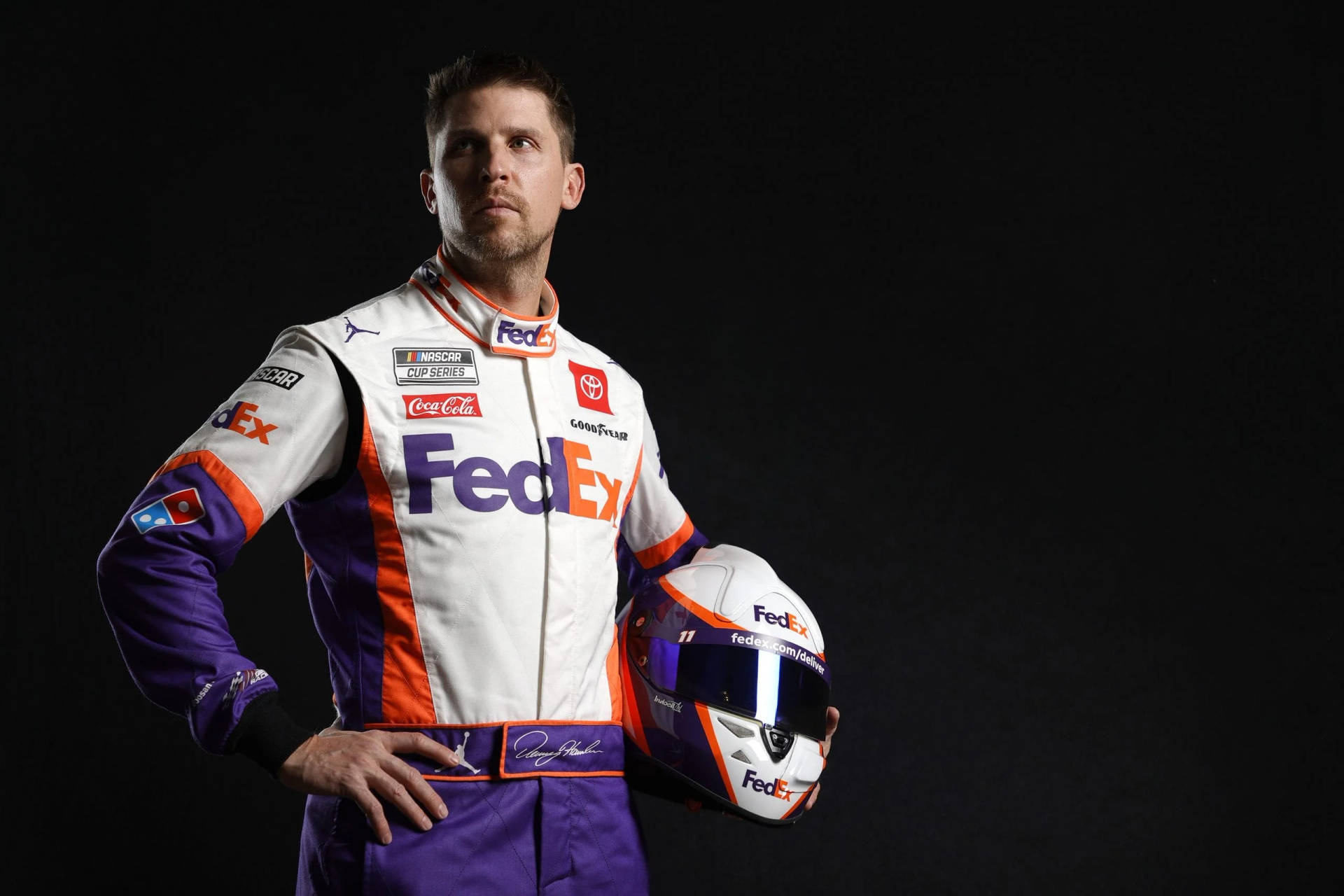 Denny Hamlin Holding Fedex Helmet Background