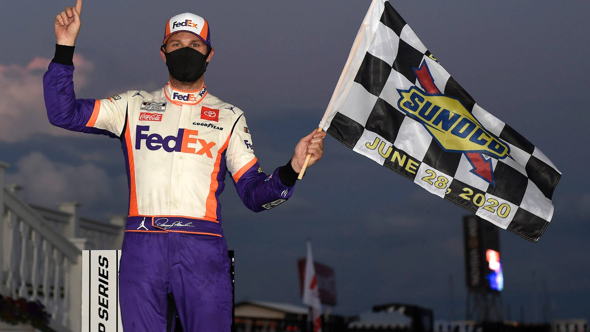 Denny Hamlin Holding Flag Background