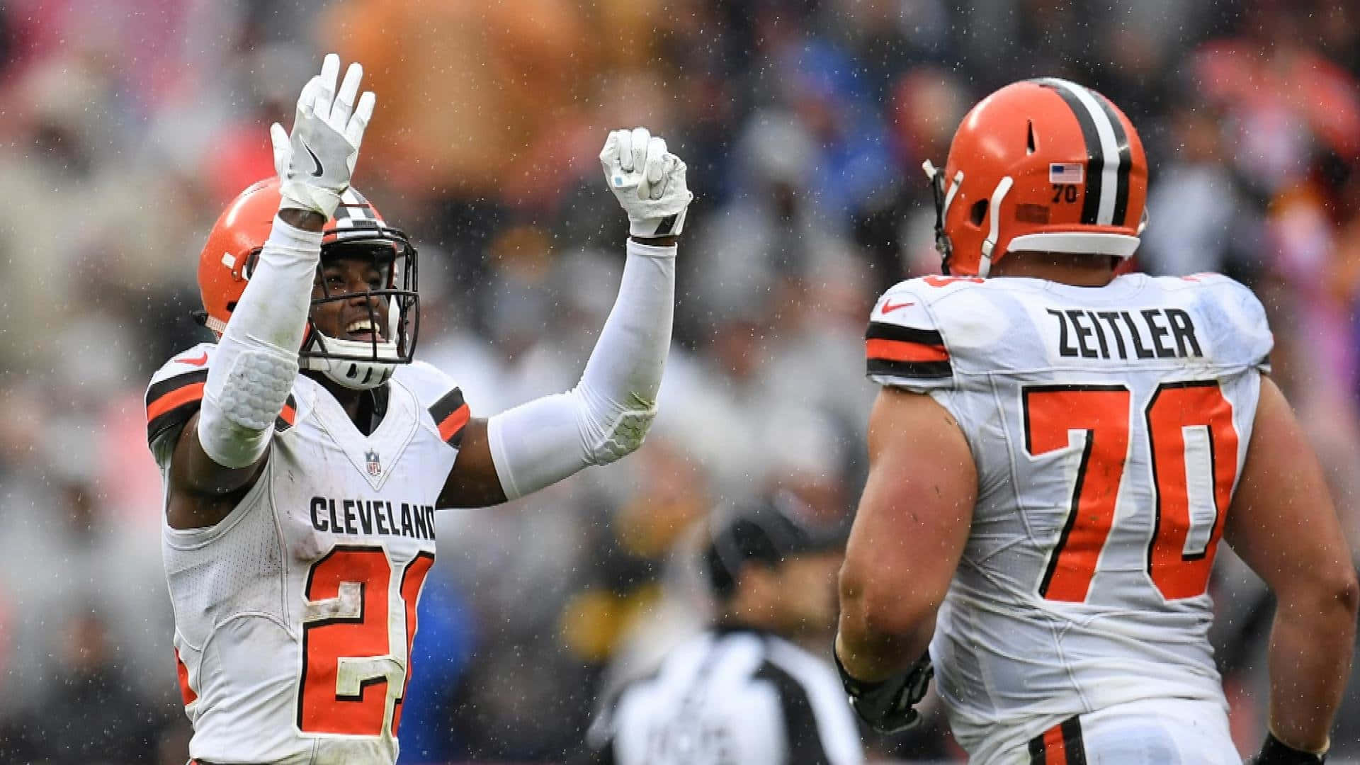 Denzel Ward Celebrating With Kevin Zeitler Background