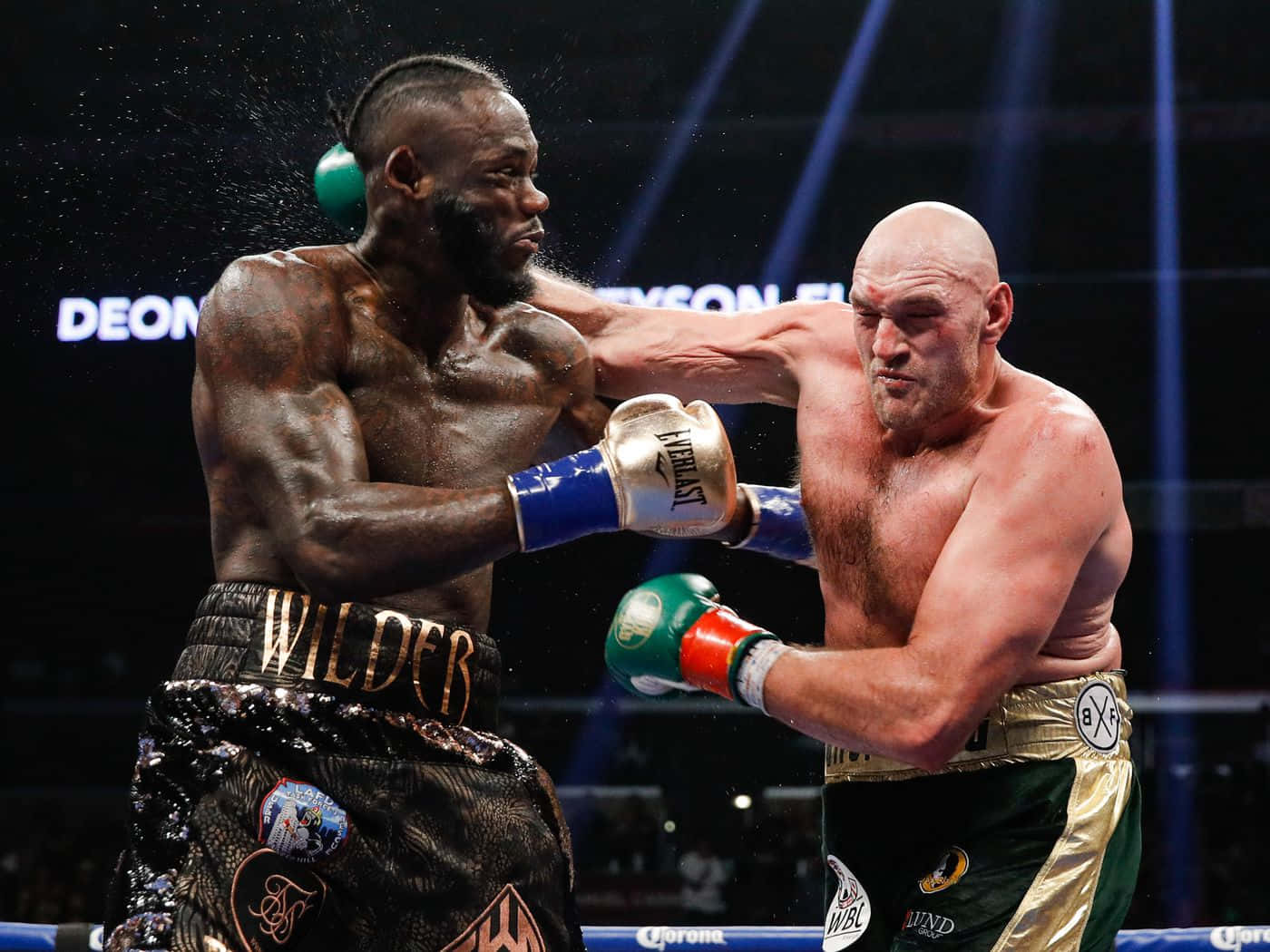 Deontay Wilder Boxing Match Powerful Punch Background