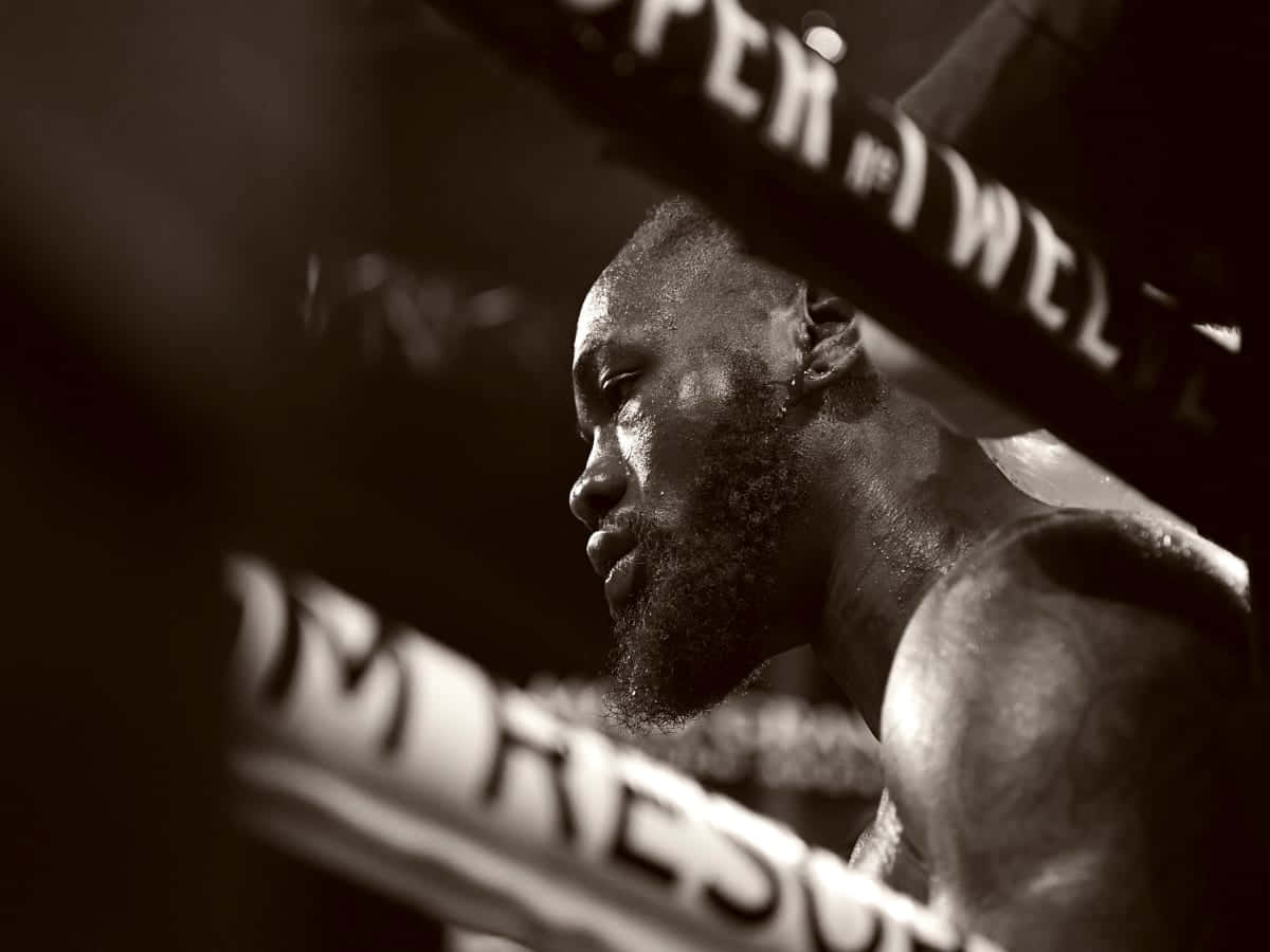 Deontay Wilder Contemplative Moment Ringside Background