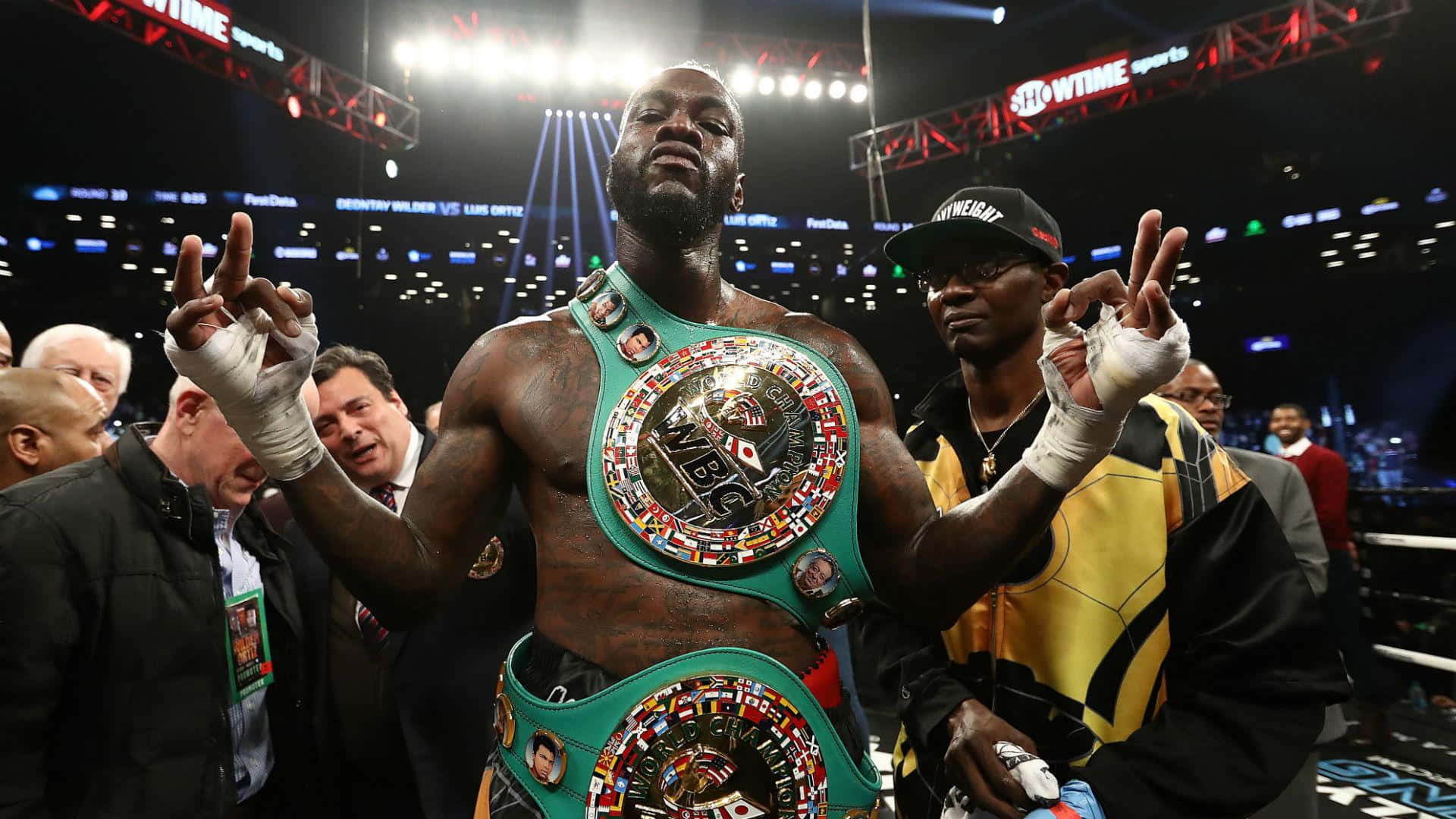 Deontay Wilder Victory Celebration With Belt Background