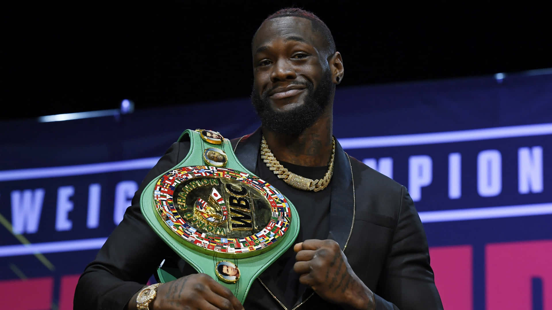 Deontay Wilder With W B C Championship Belt Background