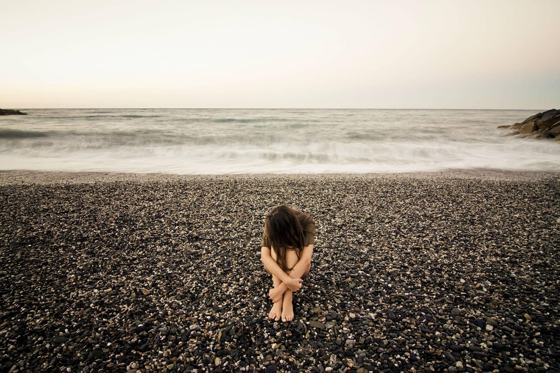 Depressed Girl On Beach Background