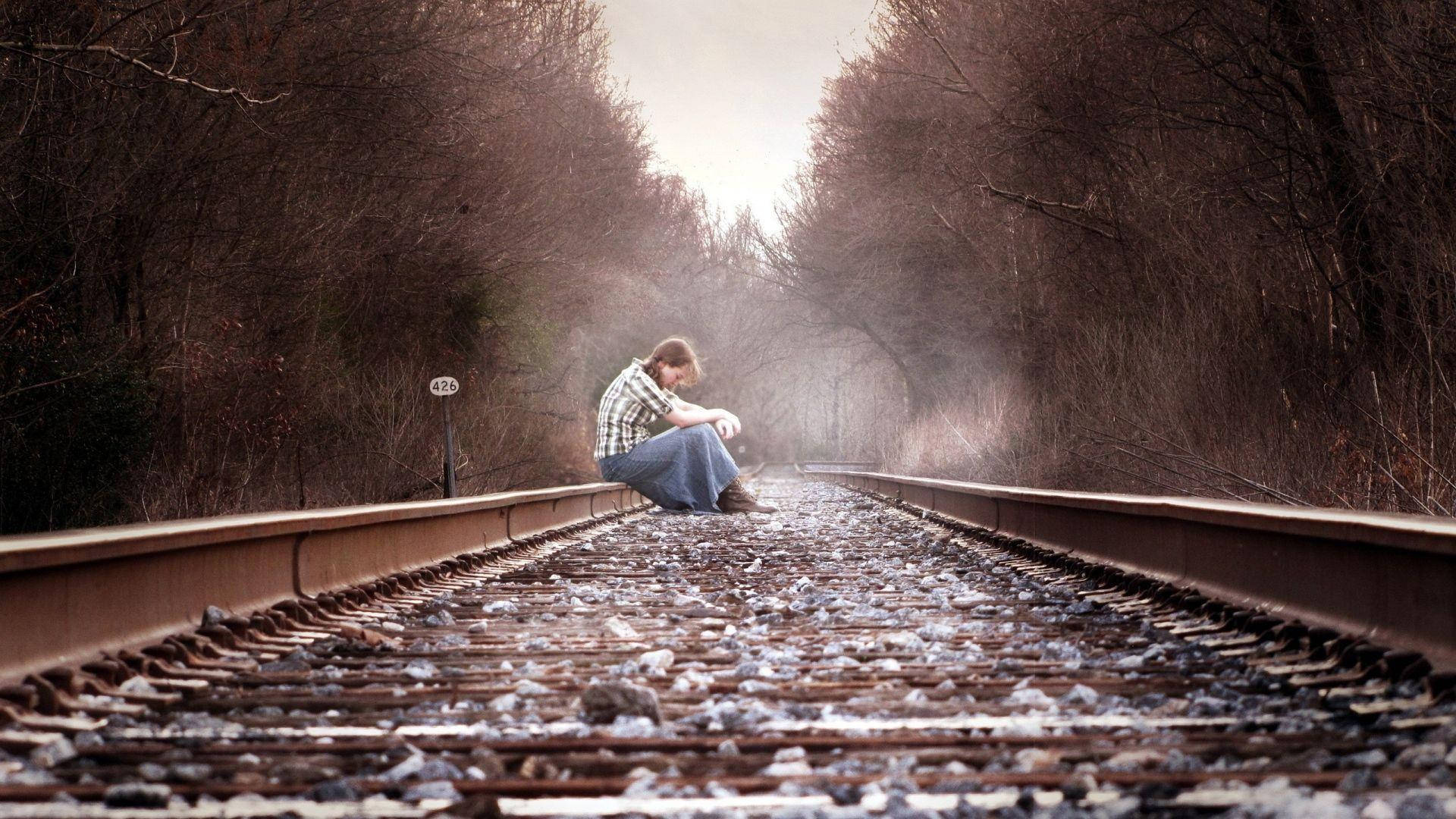 Depressed Girl On Railway Background