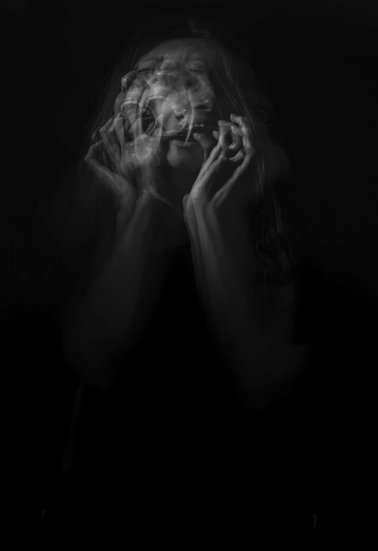 Depressed Woman Crying On Black Background