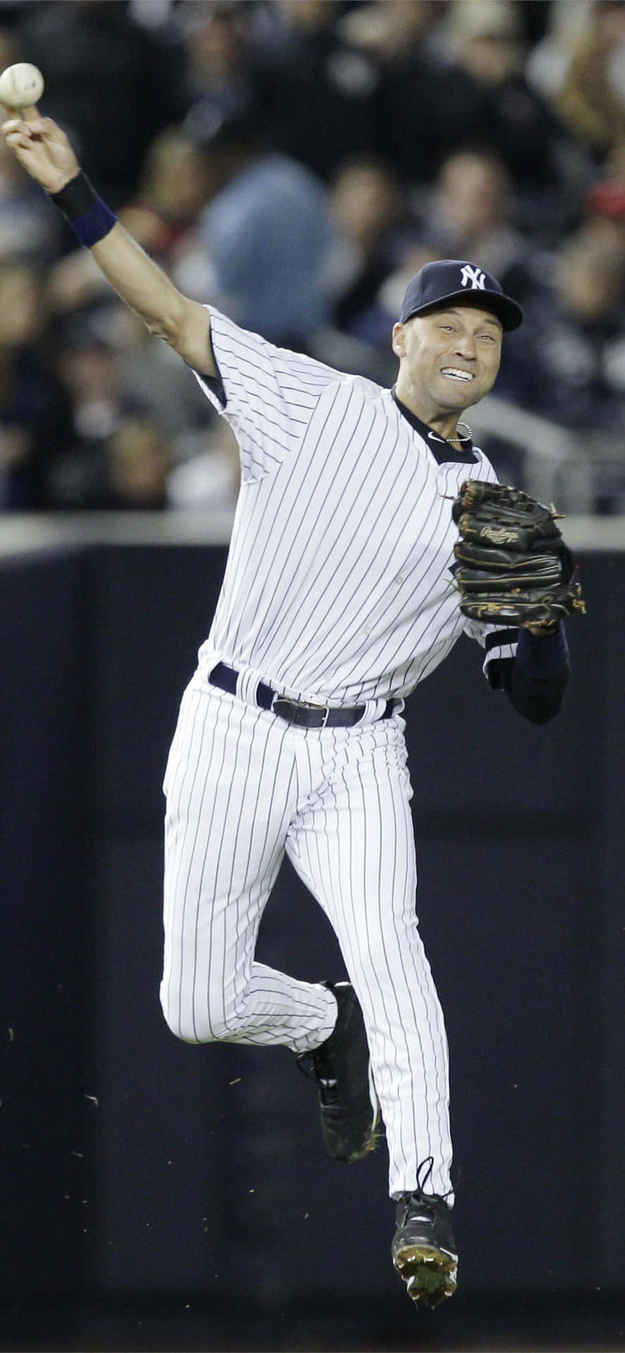 Derek Jeter Happily Playing With The Ball Background