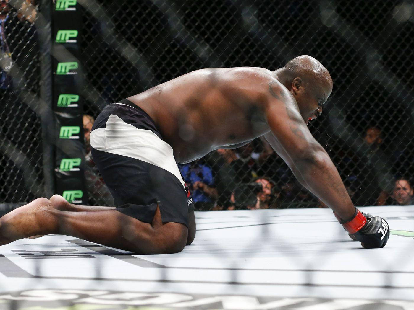 Derrick Lewis Fists On Floor Background