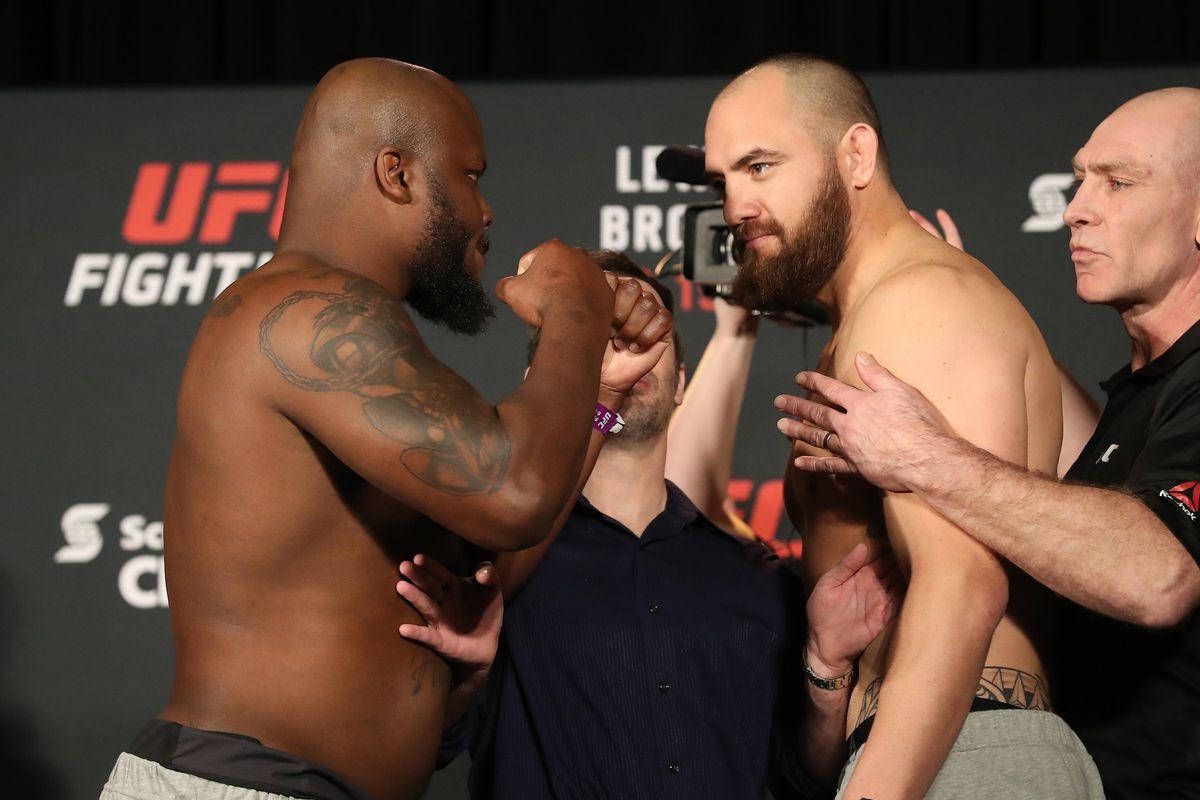 Derrick Lewis Showing Fists To Travis Browne Background