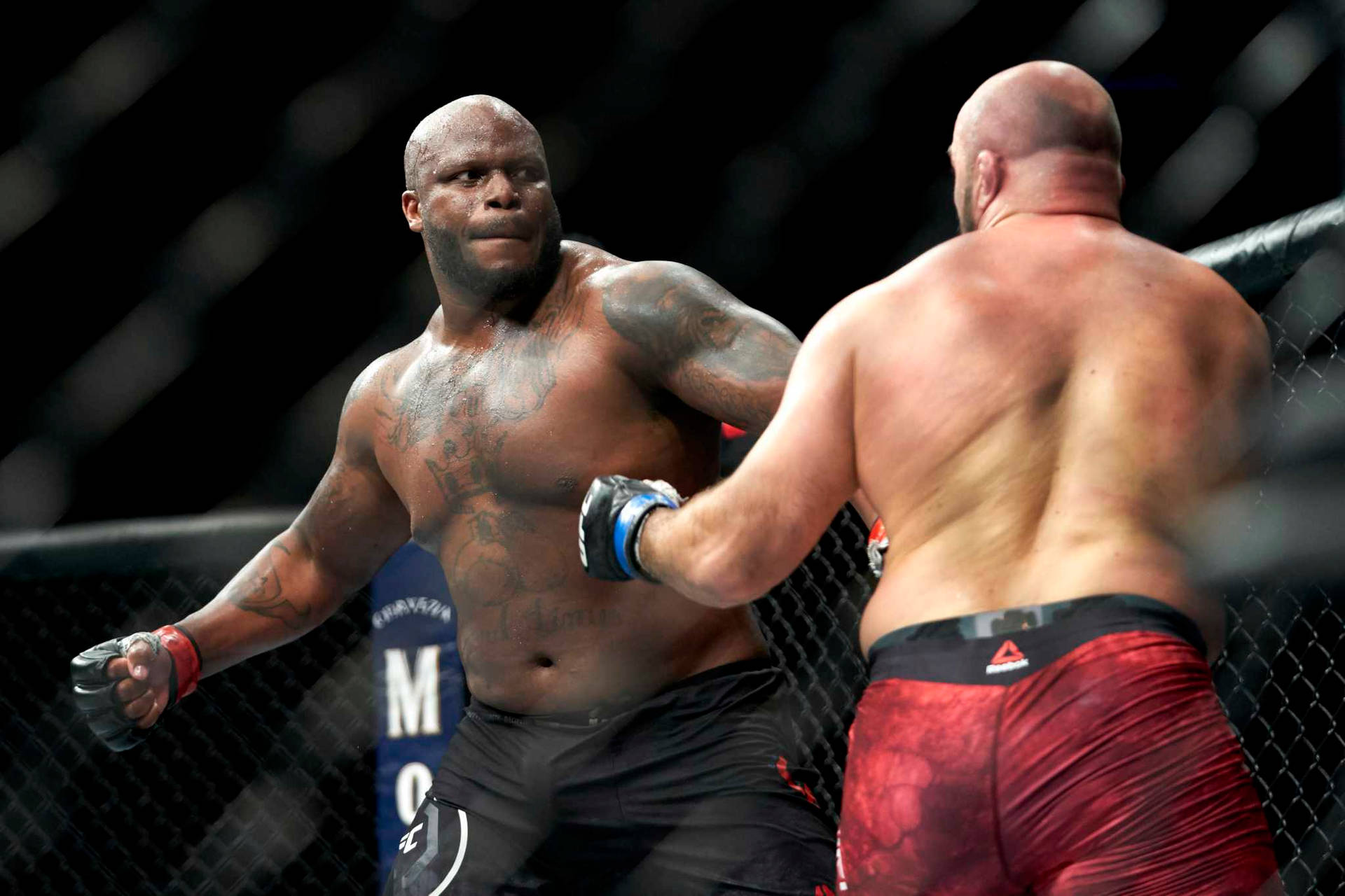 Derrick Lewis Unleashing A Powerful Punch Background