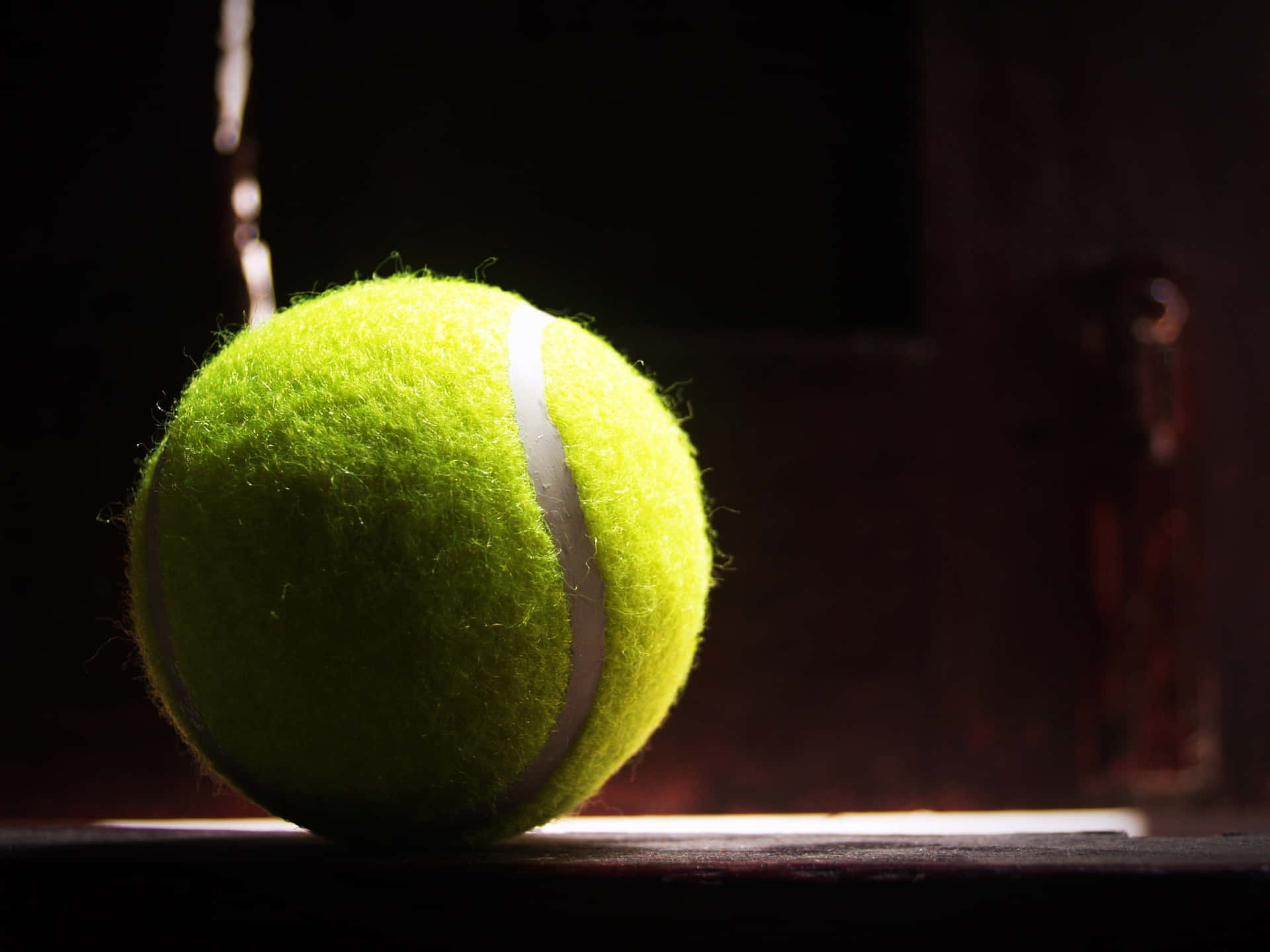 Description- Tennis Ball Flying In A Slow-motion, Blurred Background - Representing A Victorious Moment. Background