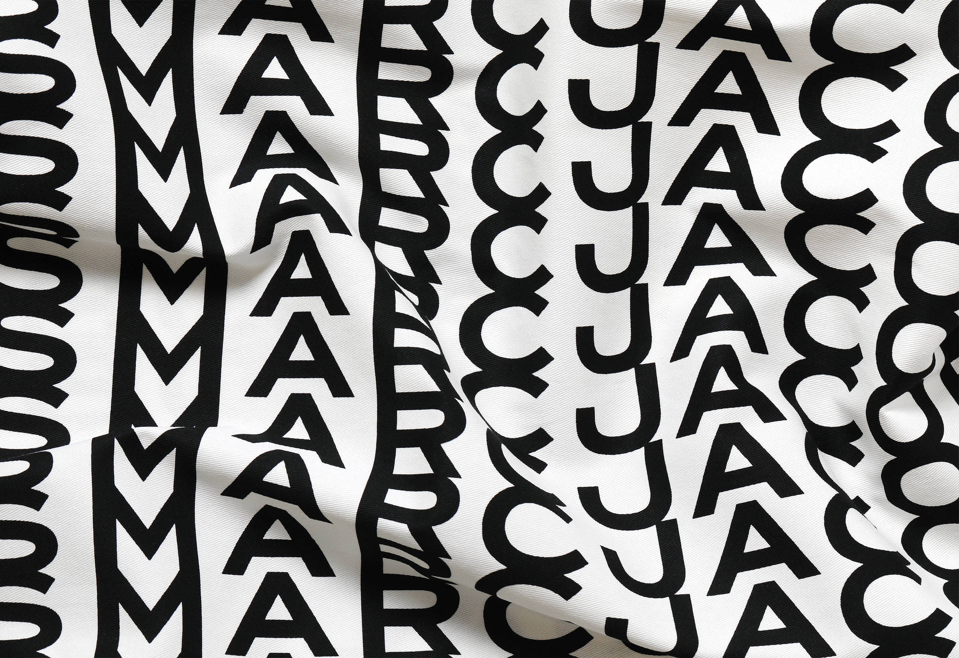 Designer Fabric With Marc Jacobs Logo Background