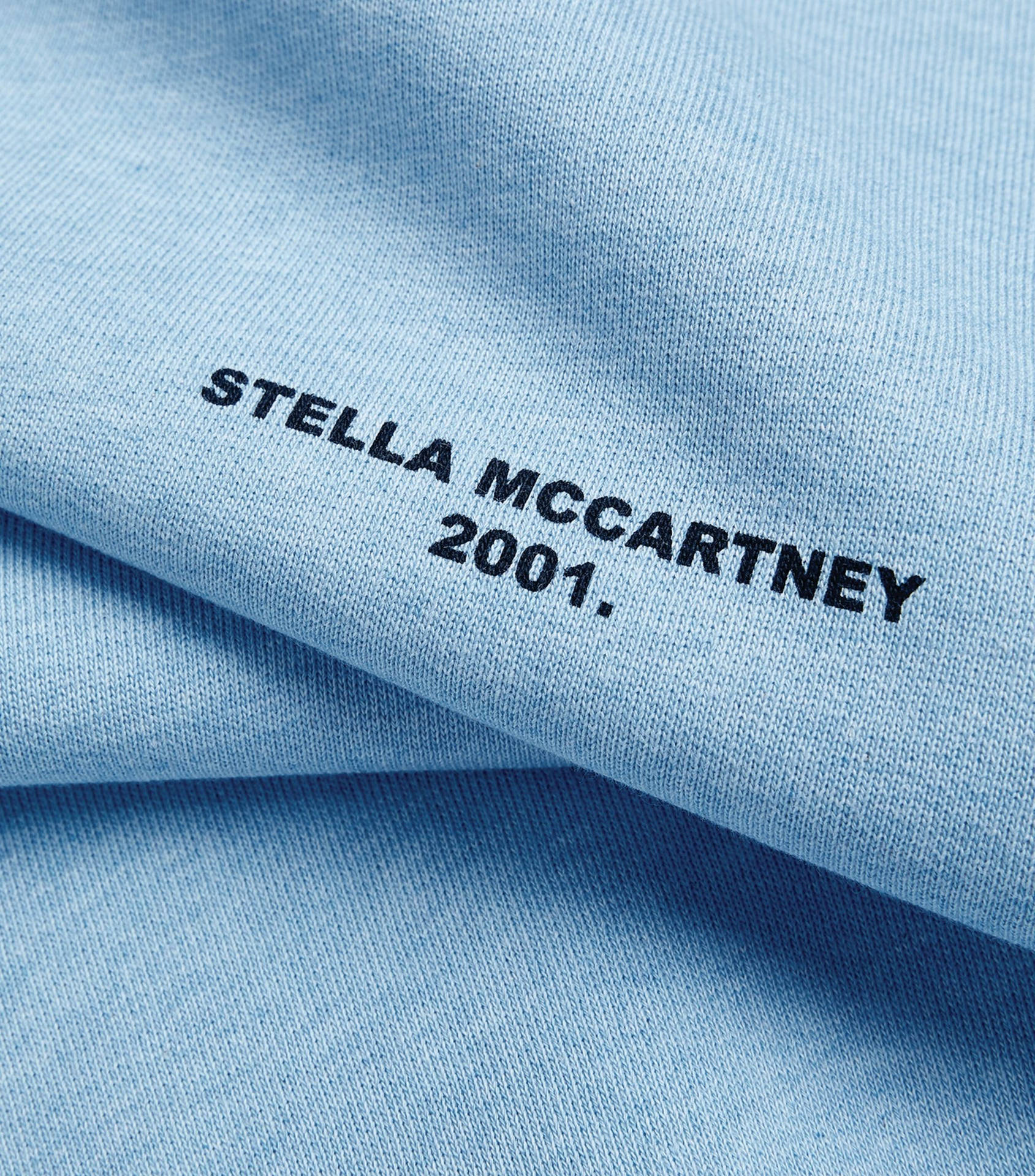 Designer Fabric With Stella Mccartney Logo Background