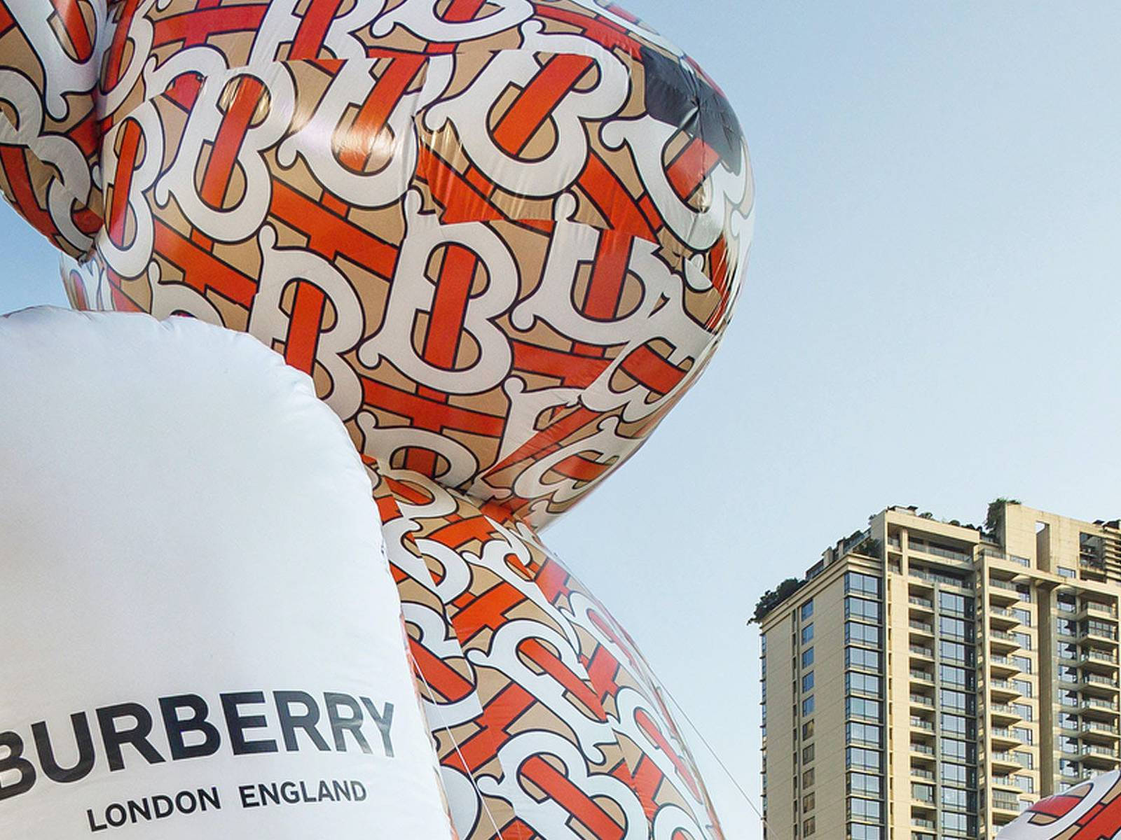 Designer Inflatable With Burberry Logo Background