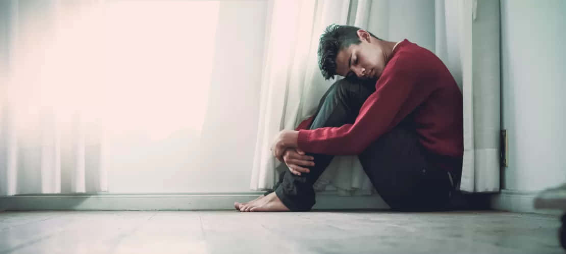 Despondent Individual Seatedon Floor