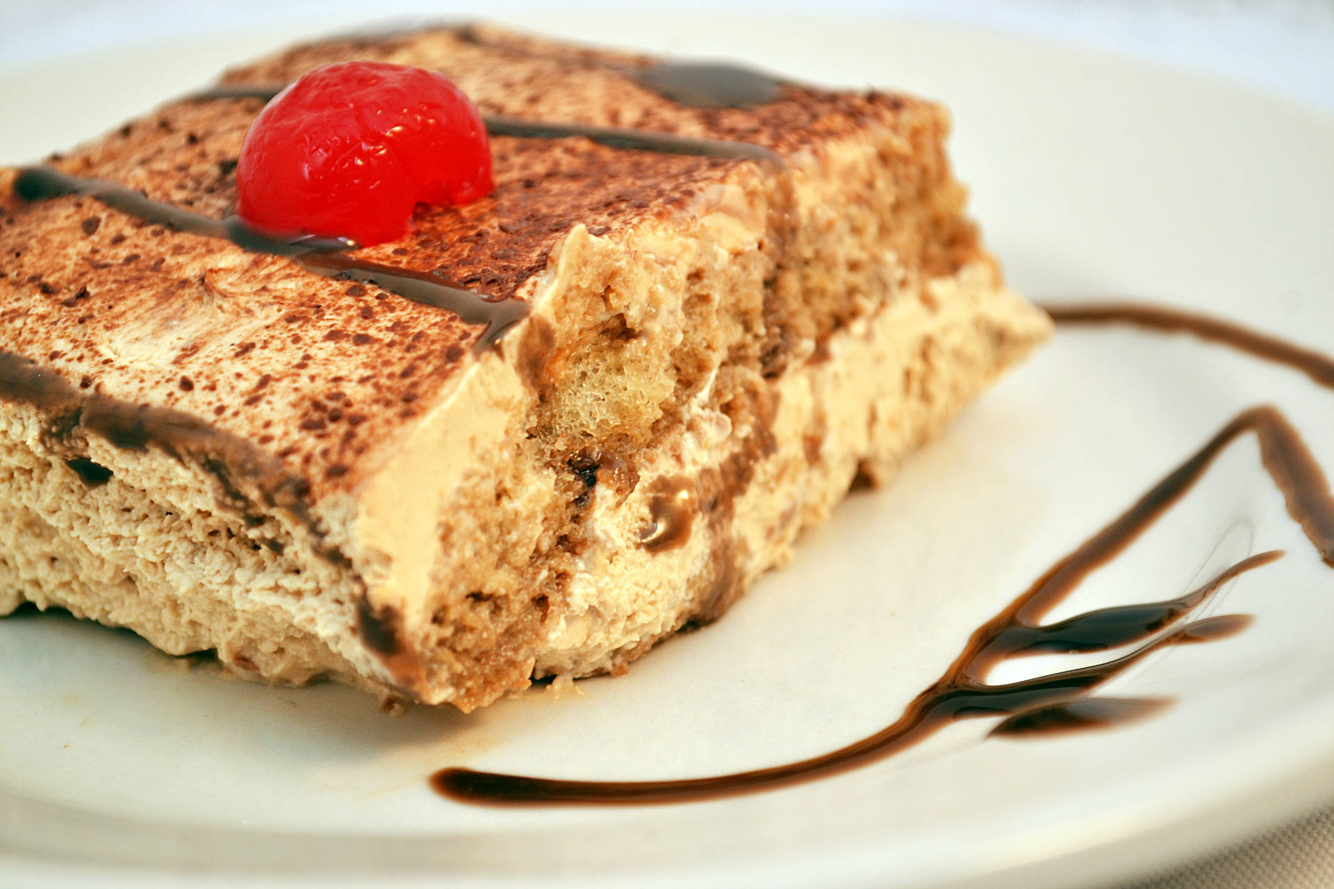 Dessert Pastries With Cherry On Top Background