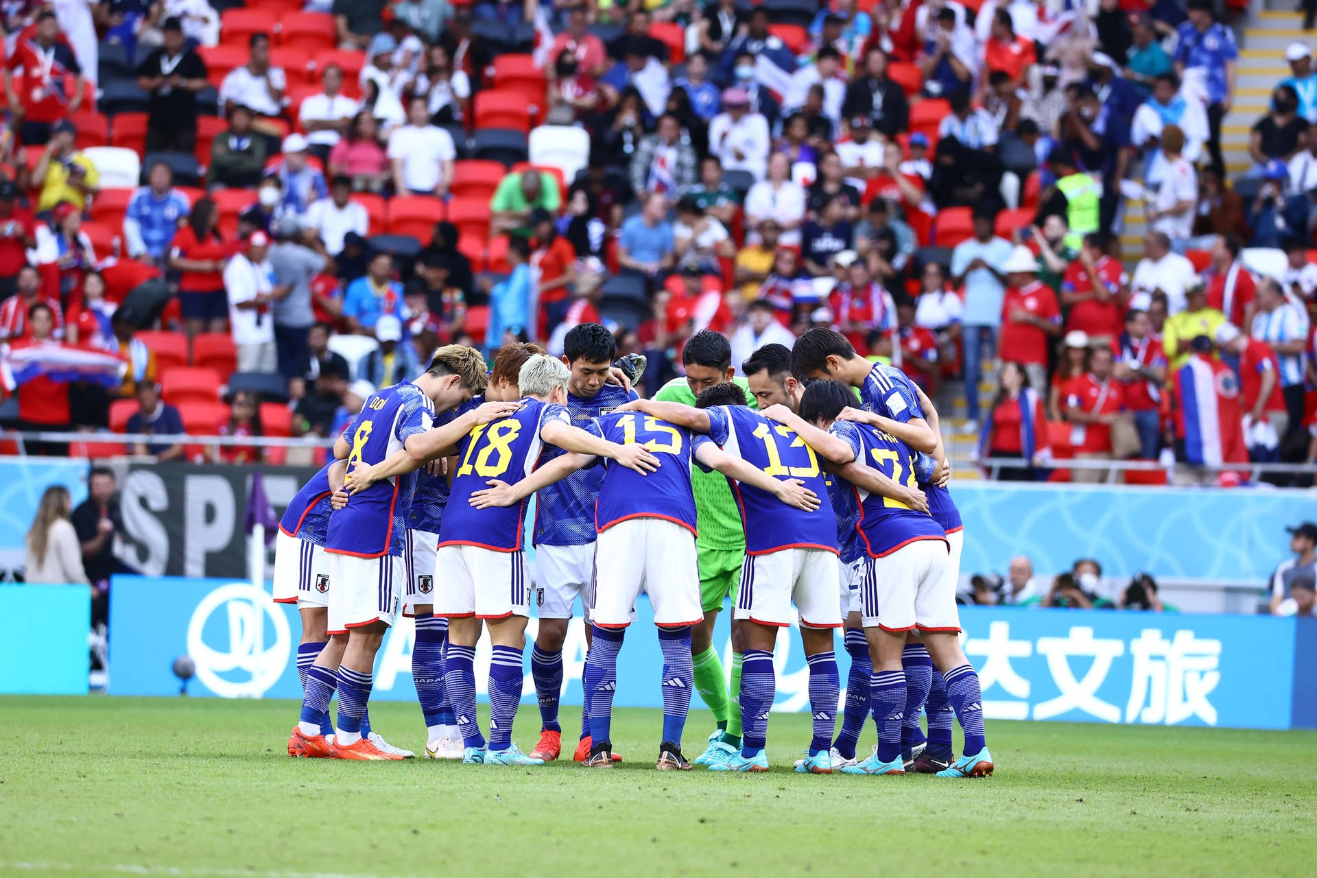 Determination On The Field - Japan National Football Team's Huddle Background