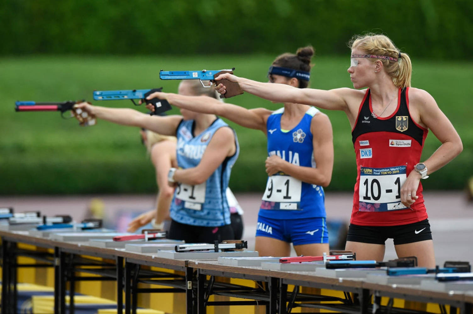 Determined Athletes Competing At The World Modern Pentathlon Championships Background