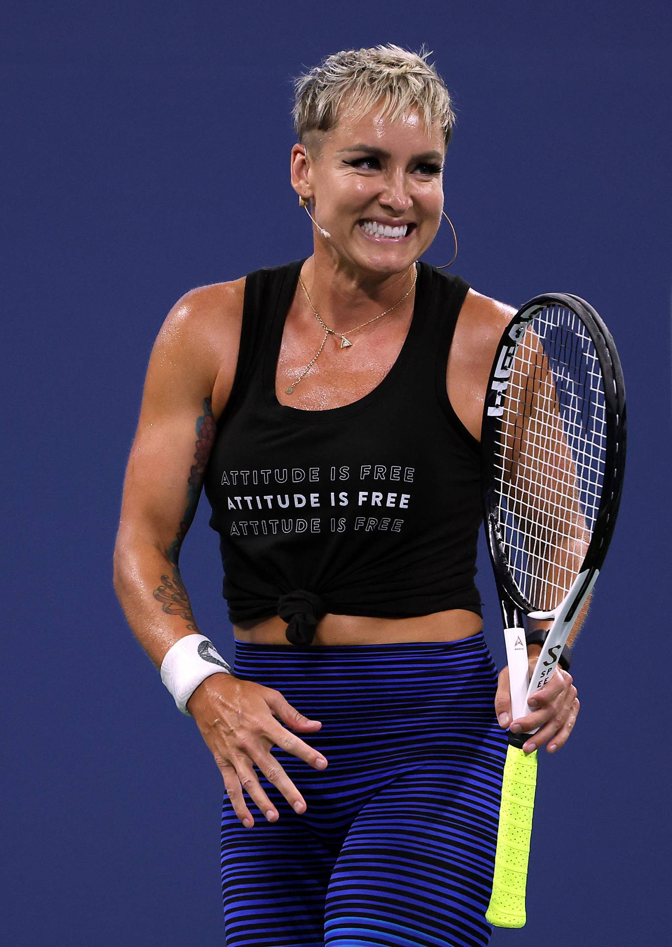 Determined Bethanie Mattek-sands With Her Signature Short Hair On Court Background