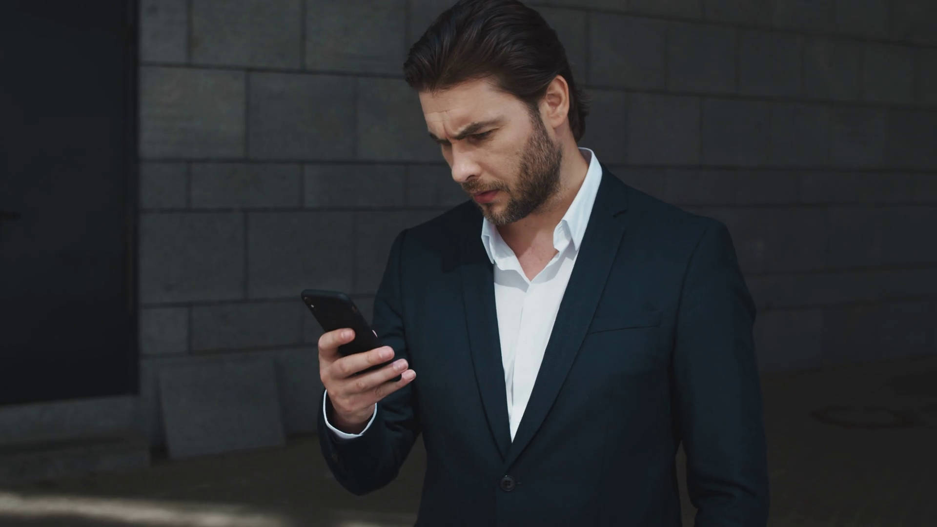 Determined Entrepreneur In A Stylish Black Suit Background