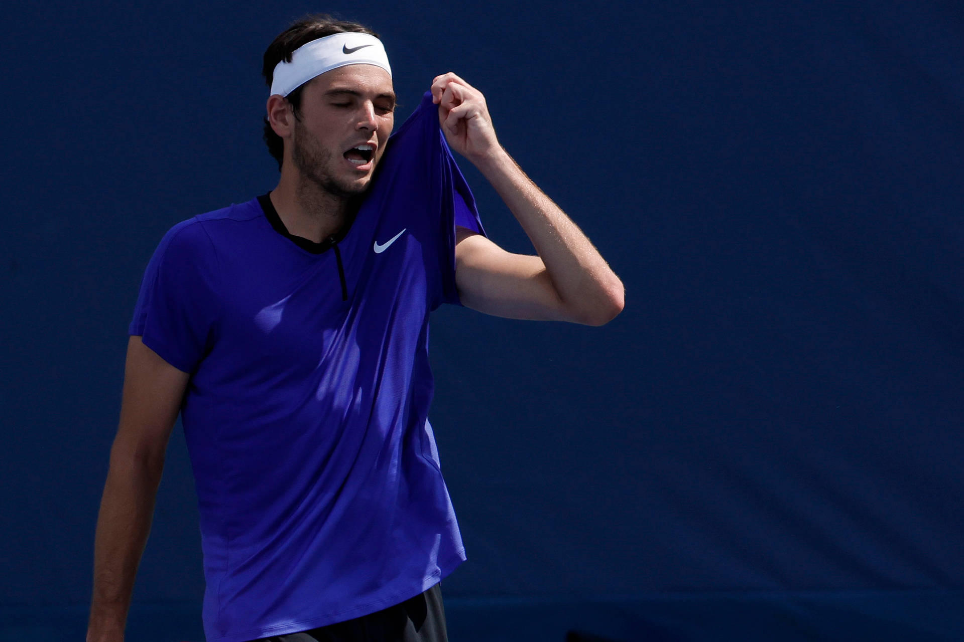 Determined Taylor Fritz Sweating It Out In A Tennis Match