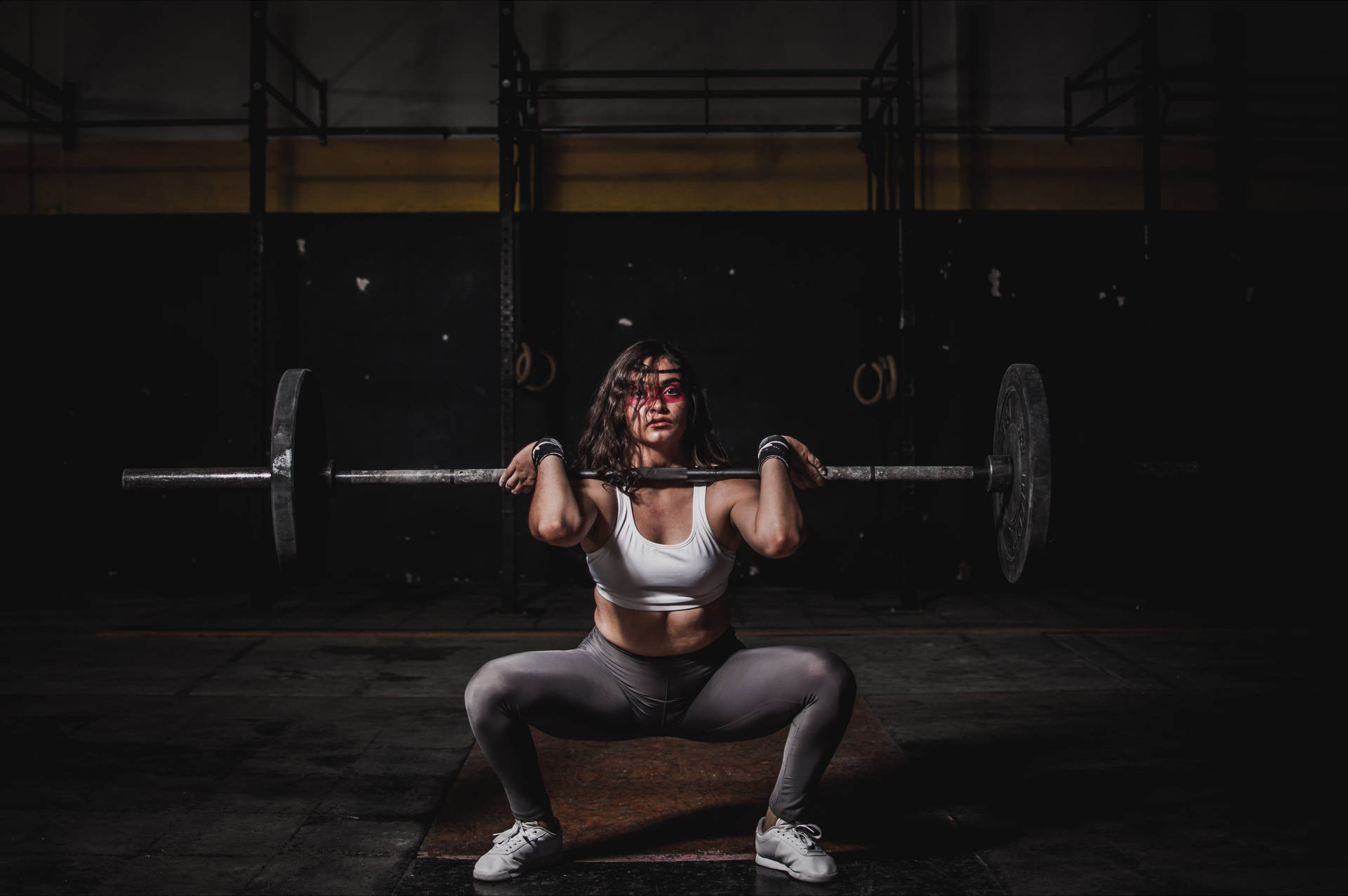 Determined Woman Mastering The Barbell