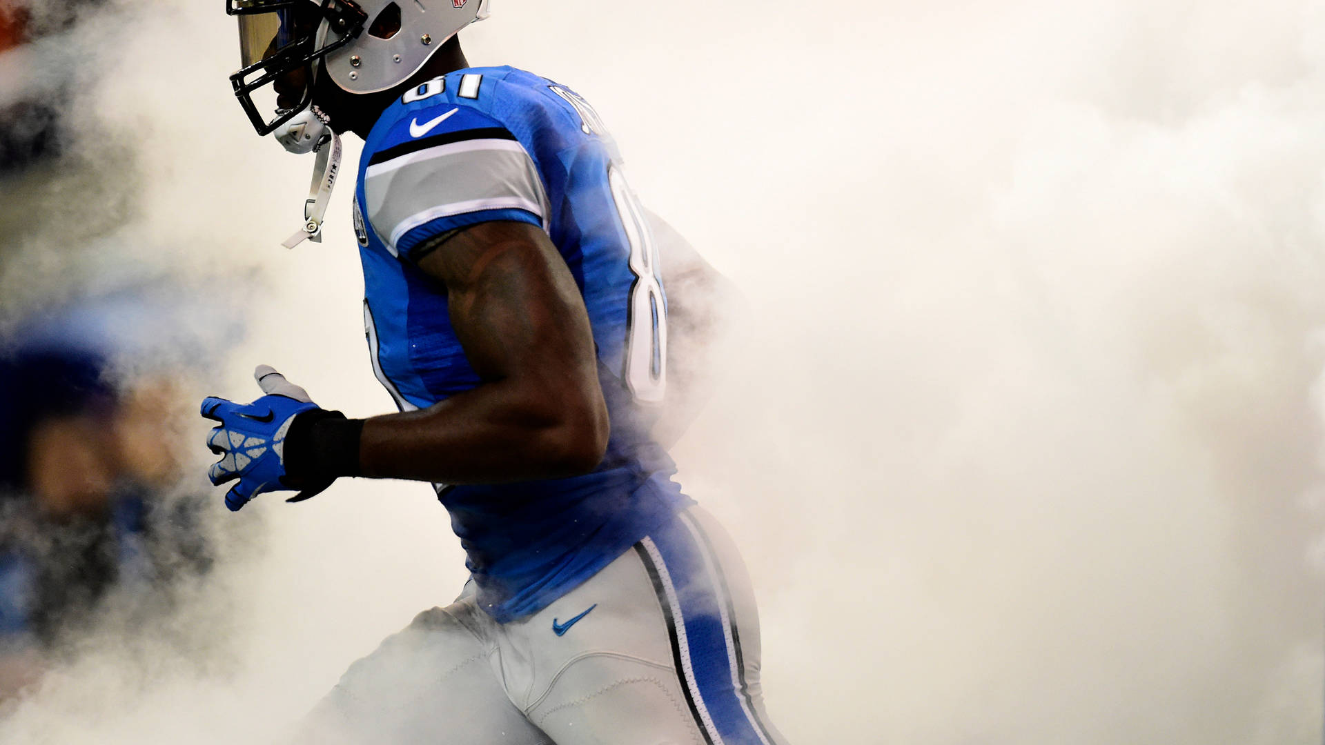Detroit Lions Player In Smokes Background