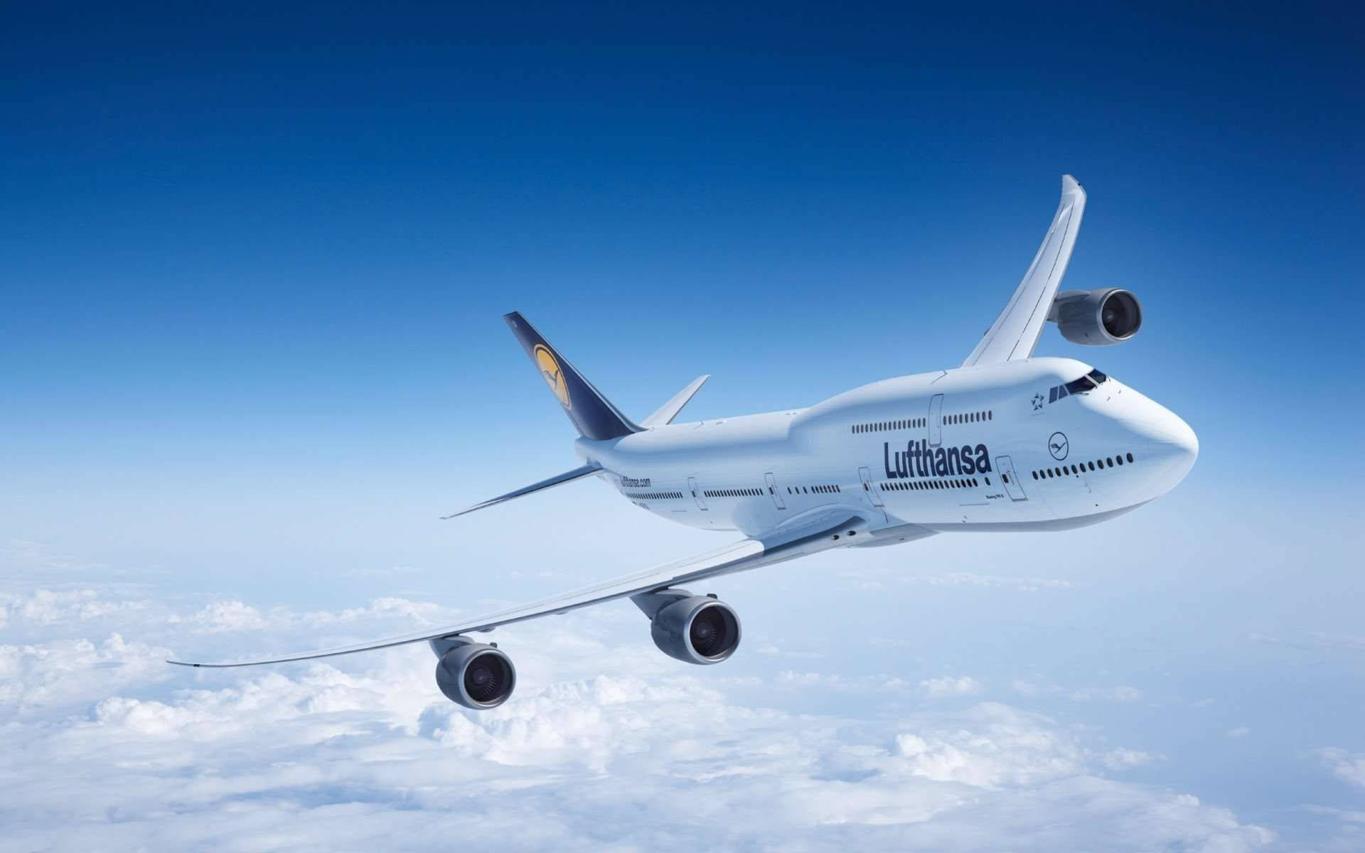 Deutsche Lufthansa Airplane On A Sea Of Clouds Background