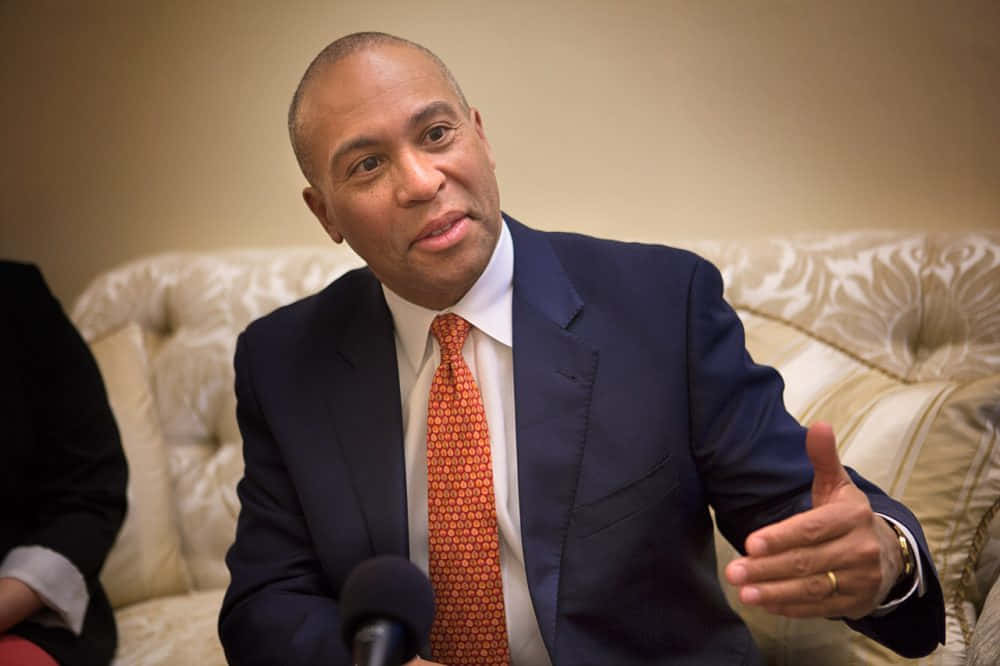 Deval Patrick Engaged In A Media Interview Background