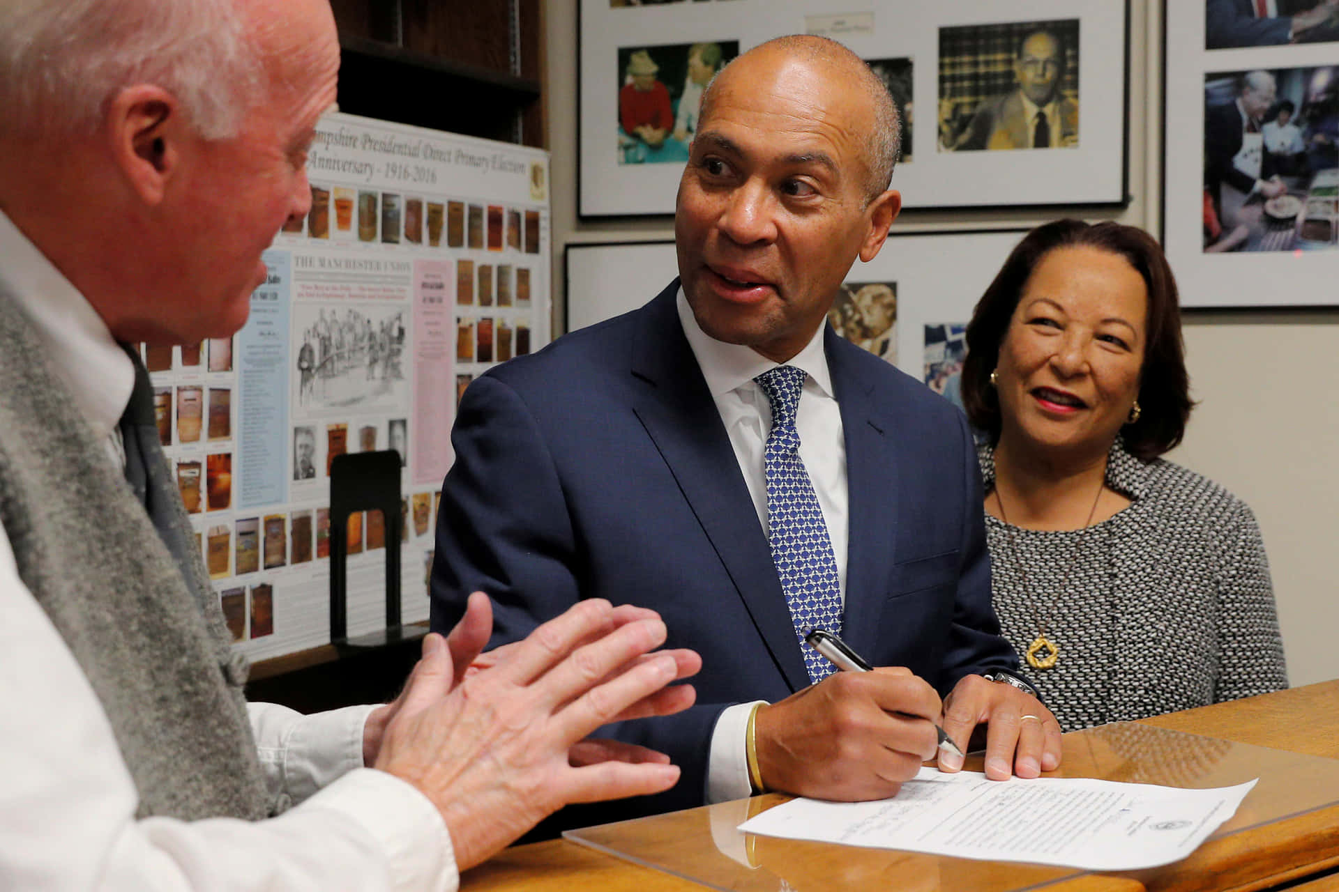 Deval Patrick Engaged In Document Signing Background
